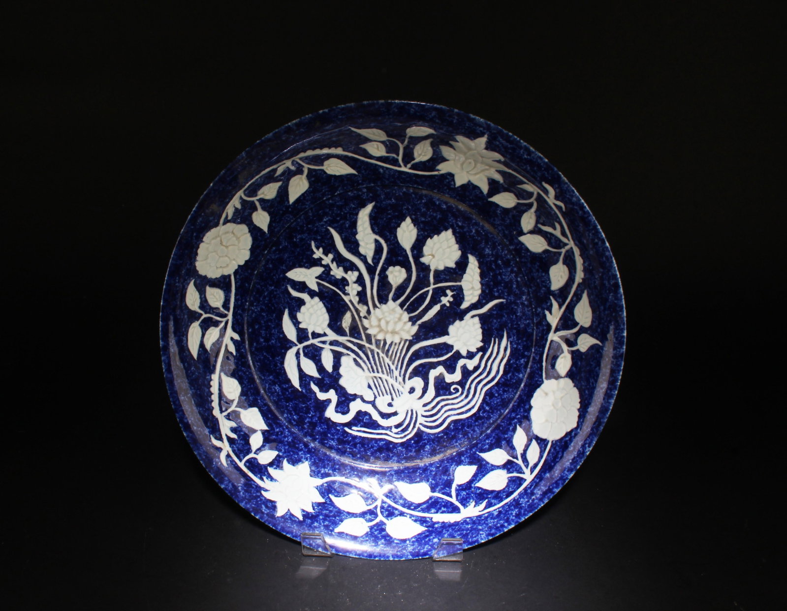 A Blue and White Charger with Flower Motif: A Blue and White Charger with Flower Motif. Dimensions: 15.1" x 2.5".
