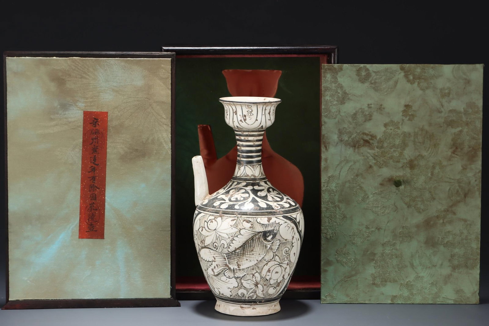 A Cizhou Porcelain Ewer: A Cizhou Porcelain Ewer. Height: 11.02in Diameter: 5.75in.