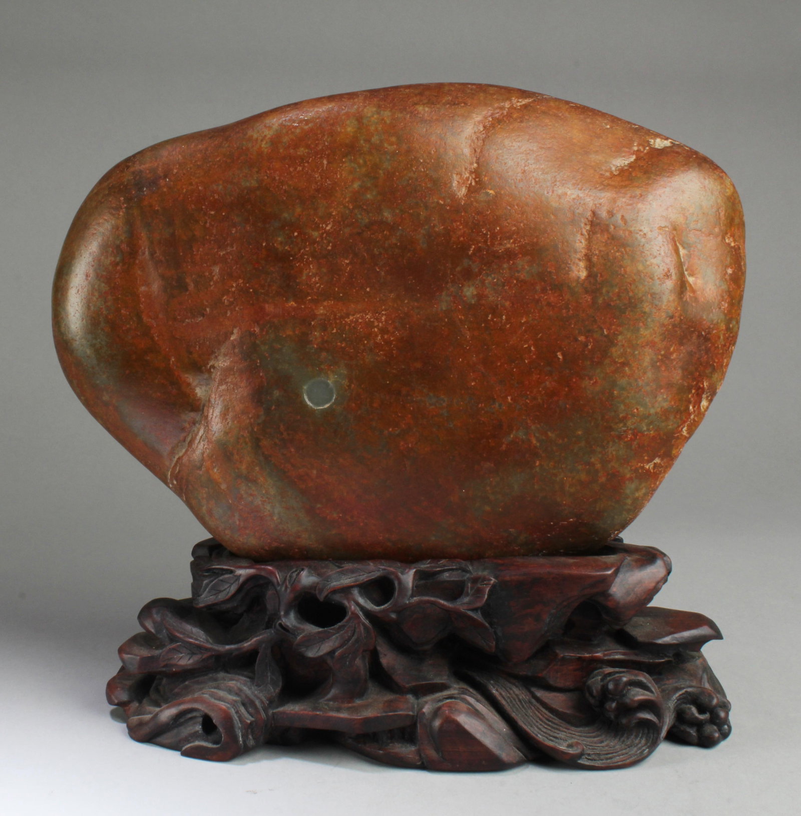 Chinese Hetian Jade Boulder with Wooden Stand: Chinese Hetian Jade Boulder with Wooden Stand. Length: 13"