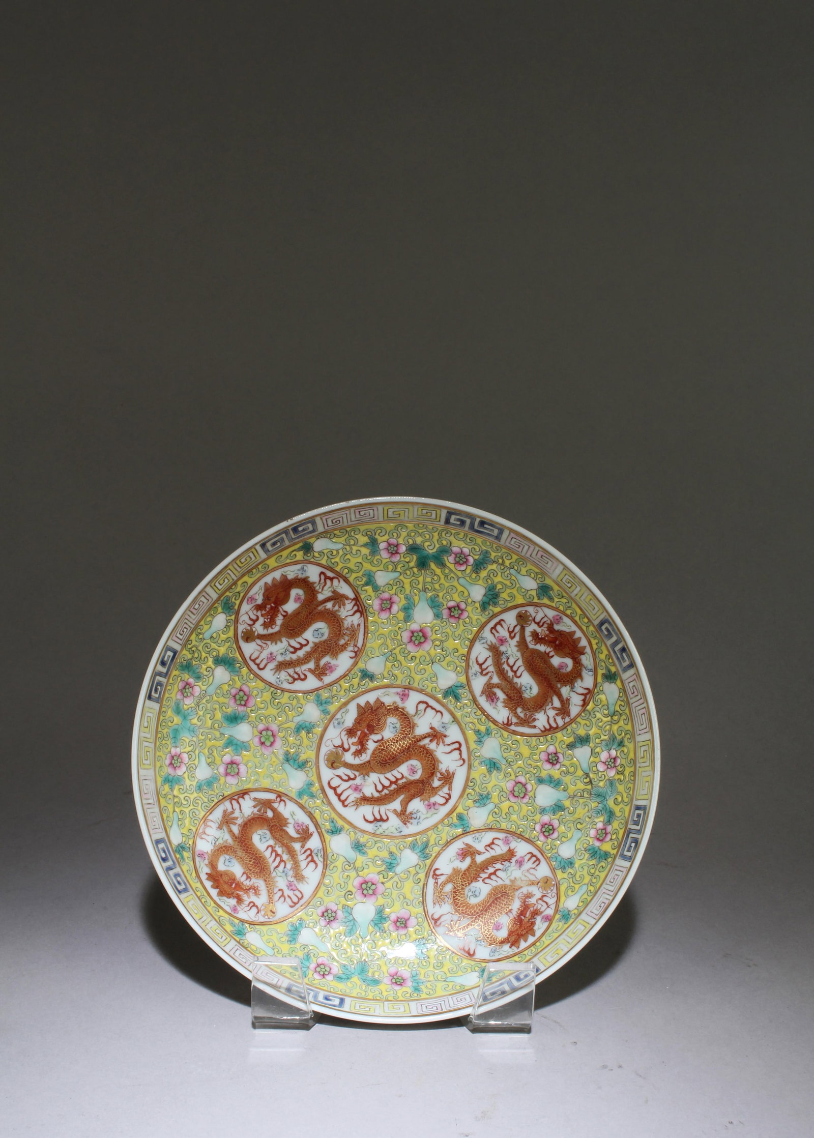 A Chinese Famille Jaune Dish: A Chinese Famille Jaune Dish. With "Tong Zhi" mark at base. Diameter: 6.75"