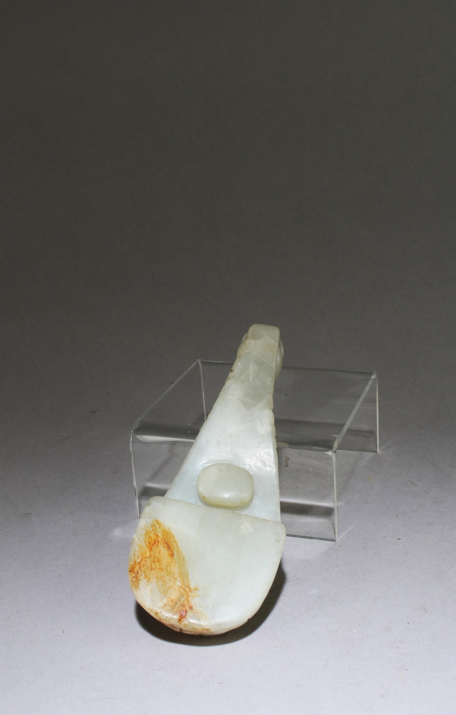 A Carved Jade Belt Hook: A Carved Jade Belt Hook. Dimensions: 4.7" X 1.75"