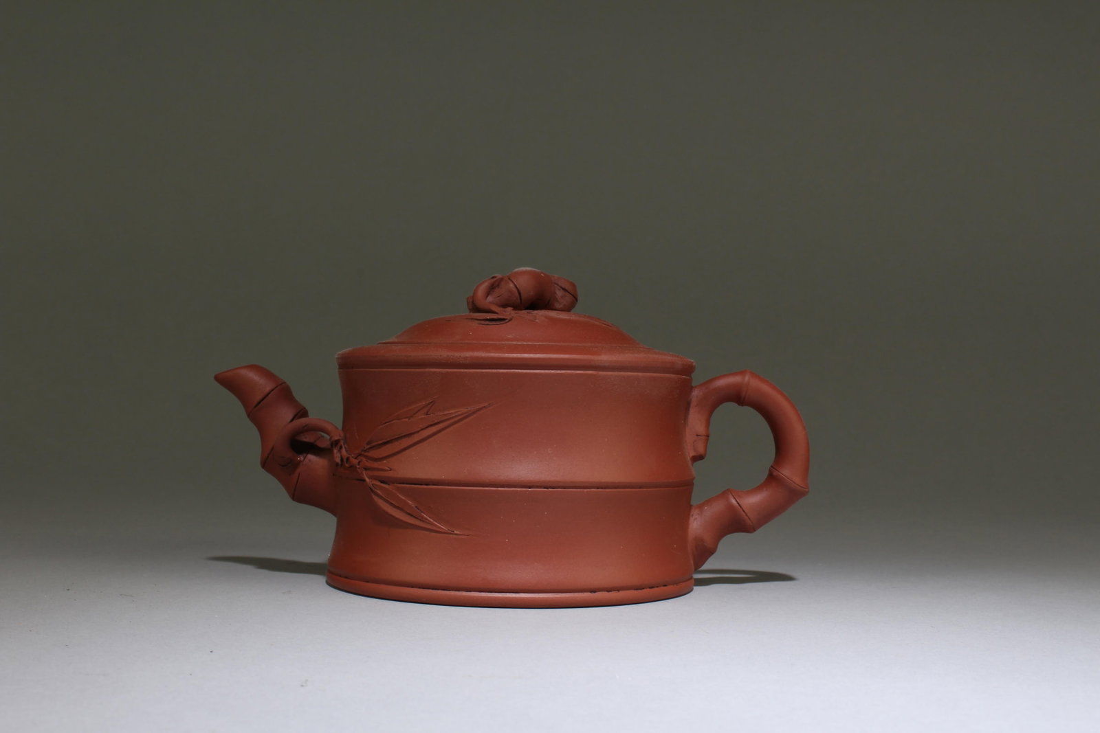 A Zisha Teapot: A Zisha Teapot. Mark at base. Dimensions: 6.8" X 3.4"