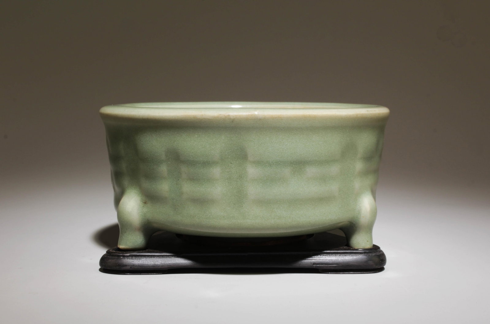 A Longquan Incense Burner with Stand: A Longquan Incense Burner with Stand. Dimension: 5" x 2.5" w/ stand.