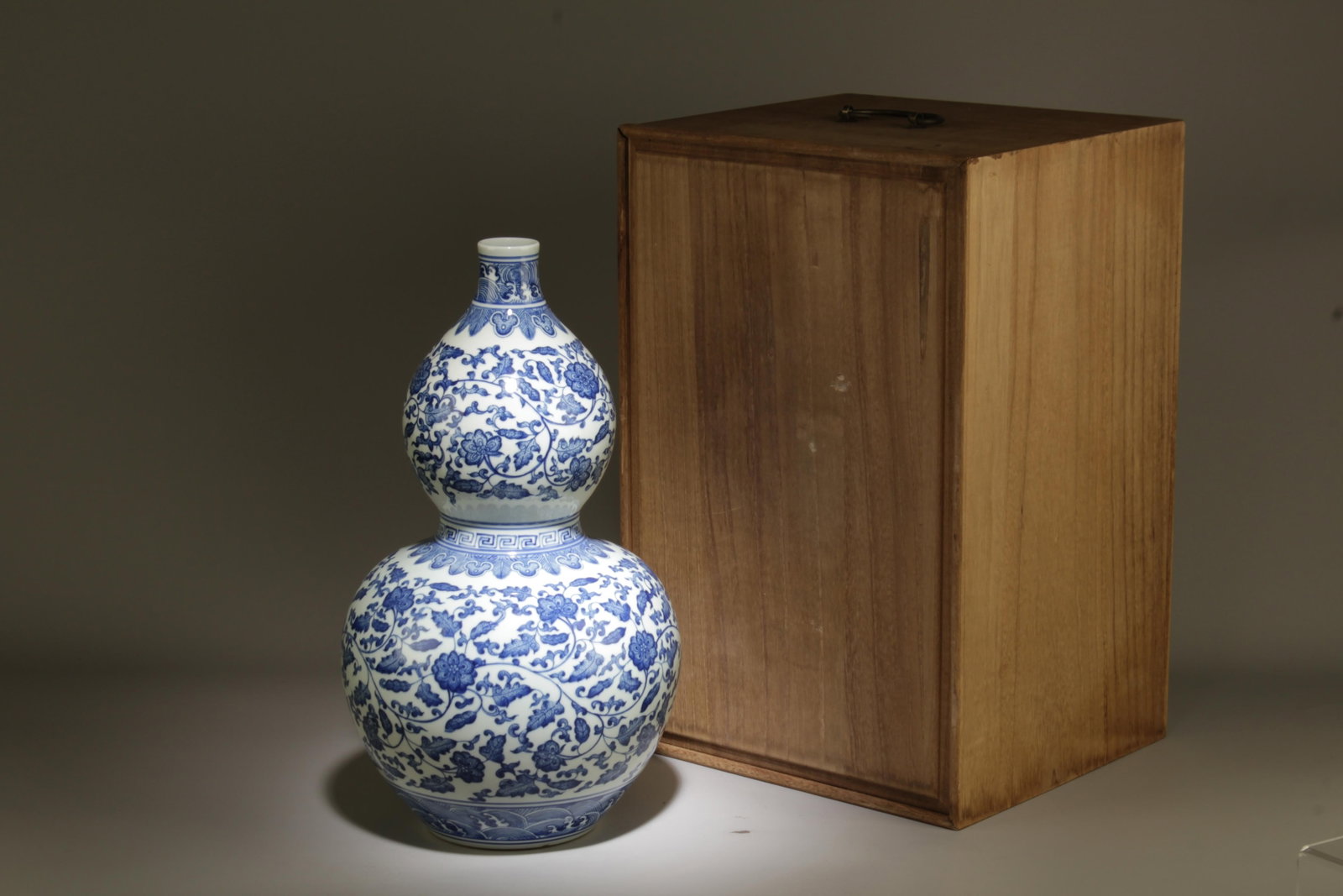 A Blue and White Double Gourd Vase: A Blue and White Double Gourd Vase. Dimensions: 9" x 16".