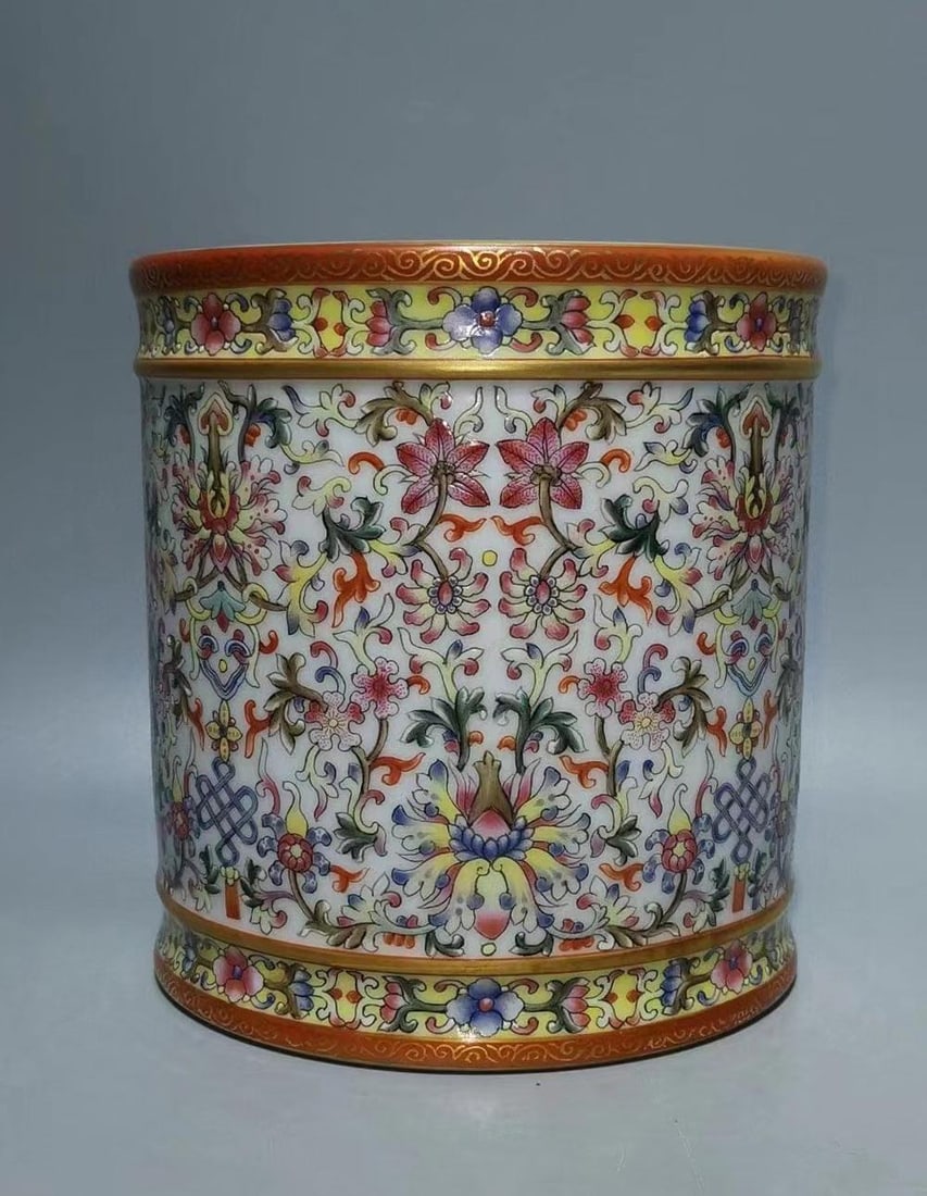 A Polychrome Round Porcelain Brushpot: A Polychrome Round Porcelain Brushpot. 'QianLong' mark. Height: 5.7" Diameter: 5.4"
