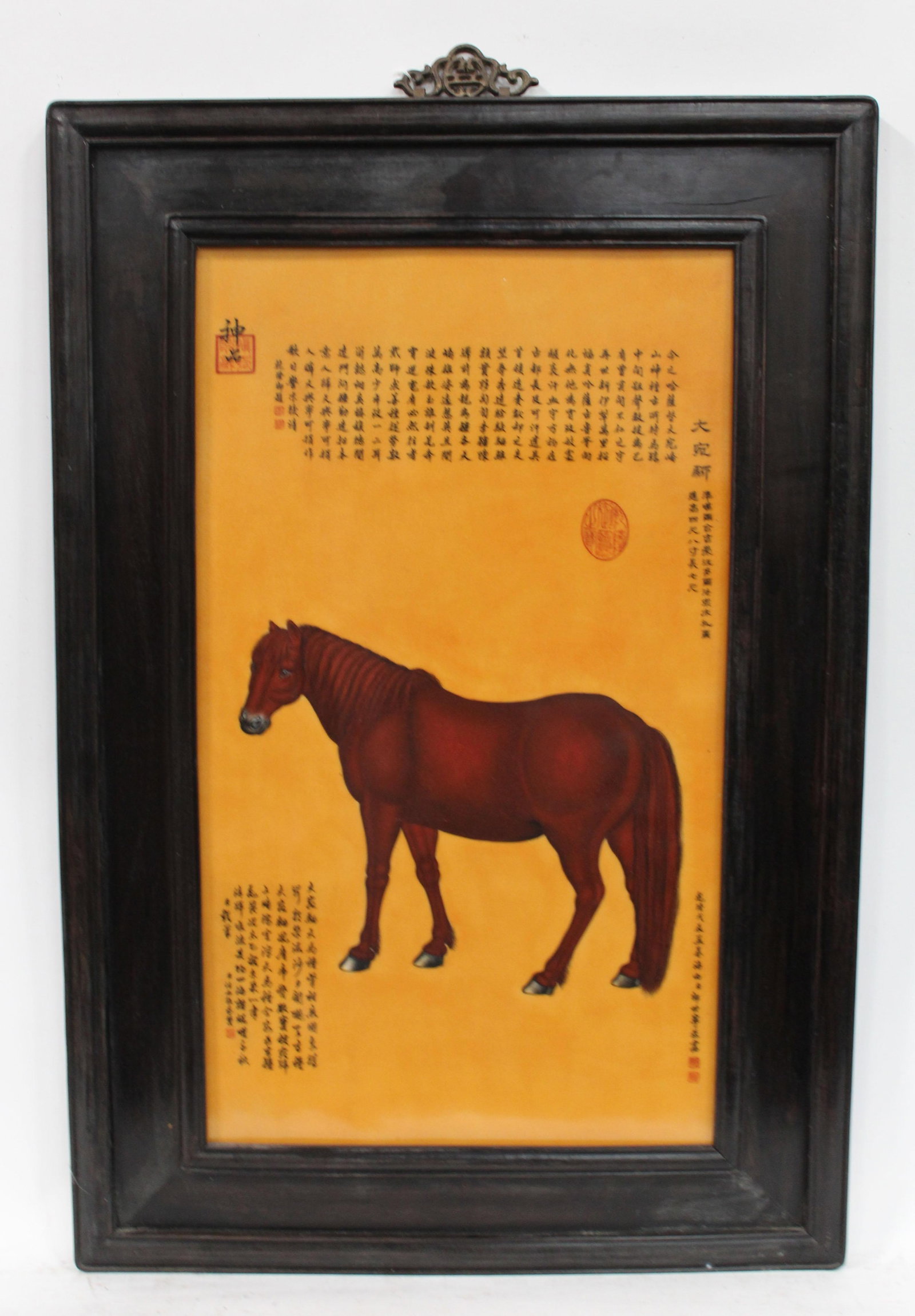 A Hardwood Framed Porcelain Plaque: A Hardwood Framed Porcelain Plaque, painting of a horse with yellow color background. Length: 24.25" Height: 36" (Frame)