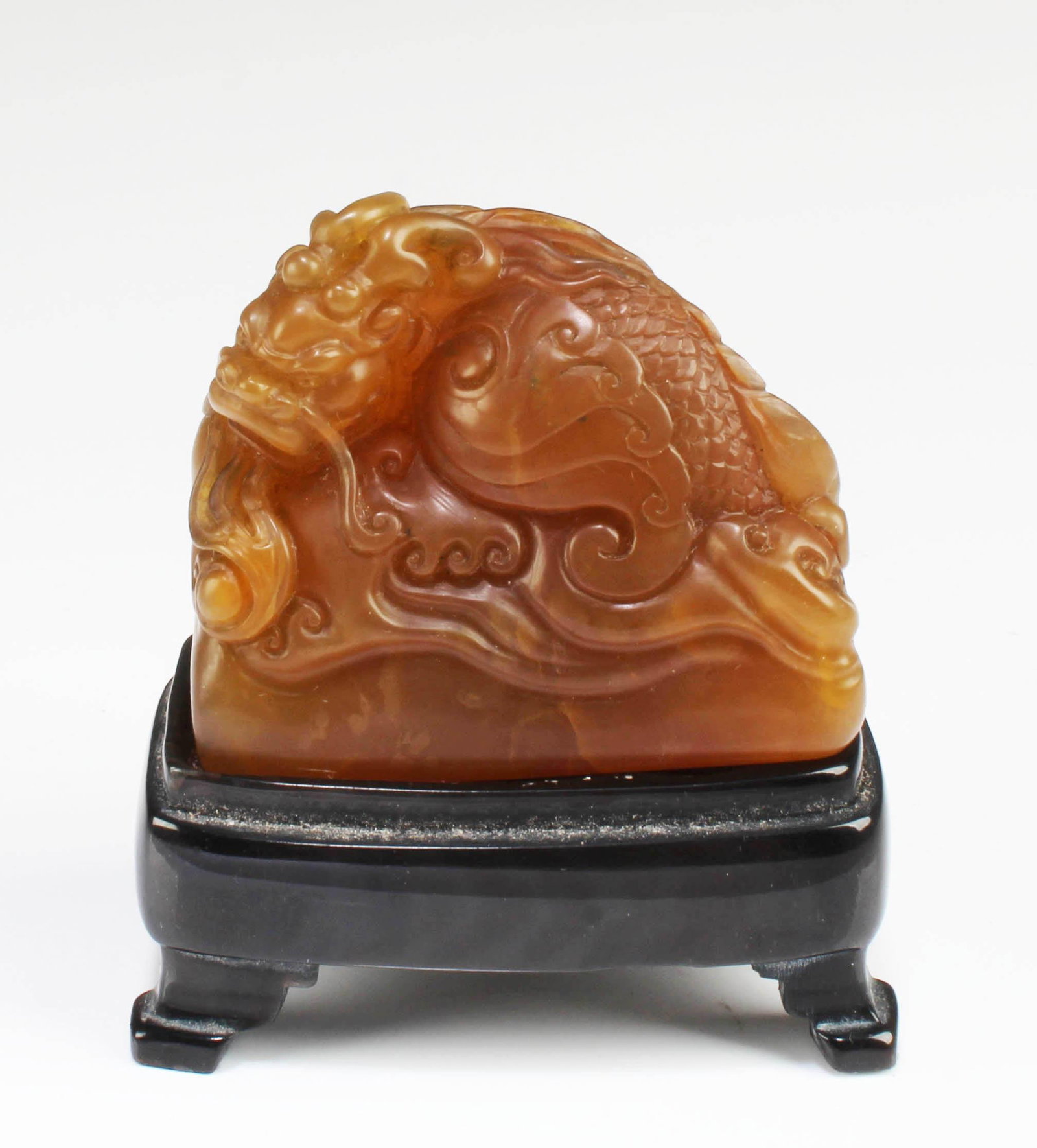 A Carved Tianhuang Ornament: A Carved Tianhuang Ornament. Comes fitted with a wooden stand. Height: 1.7" Length: 2" Weight: 86.3"