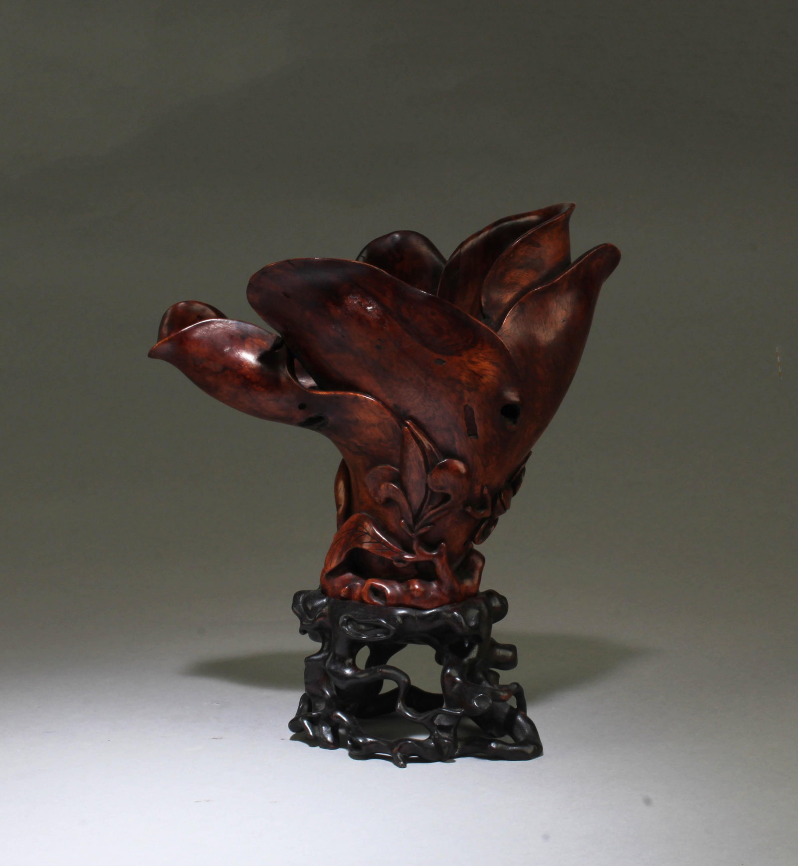 A Carved HuangHuaLi Flower-Shaped Cup: A Carved HuangHuaLi Flower-Shaped Cup. Comes fitted with a stand. Height: 7.85" (Include stand)