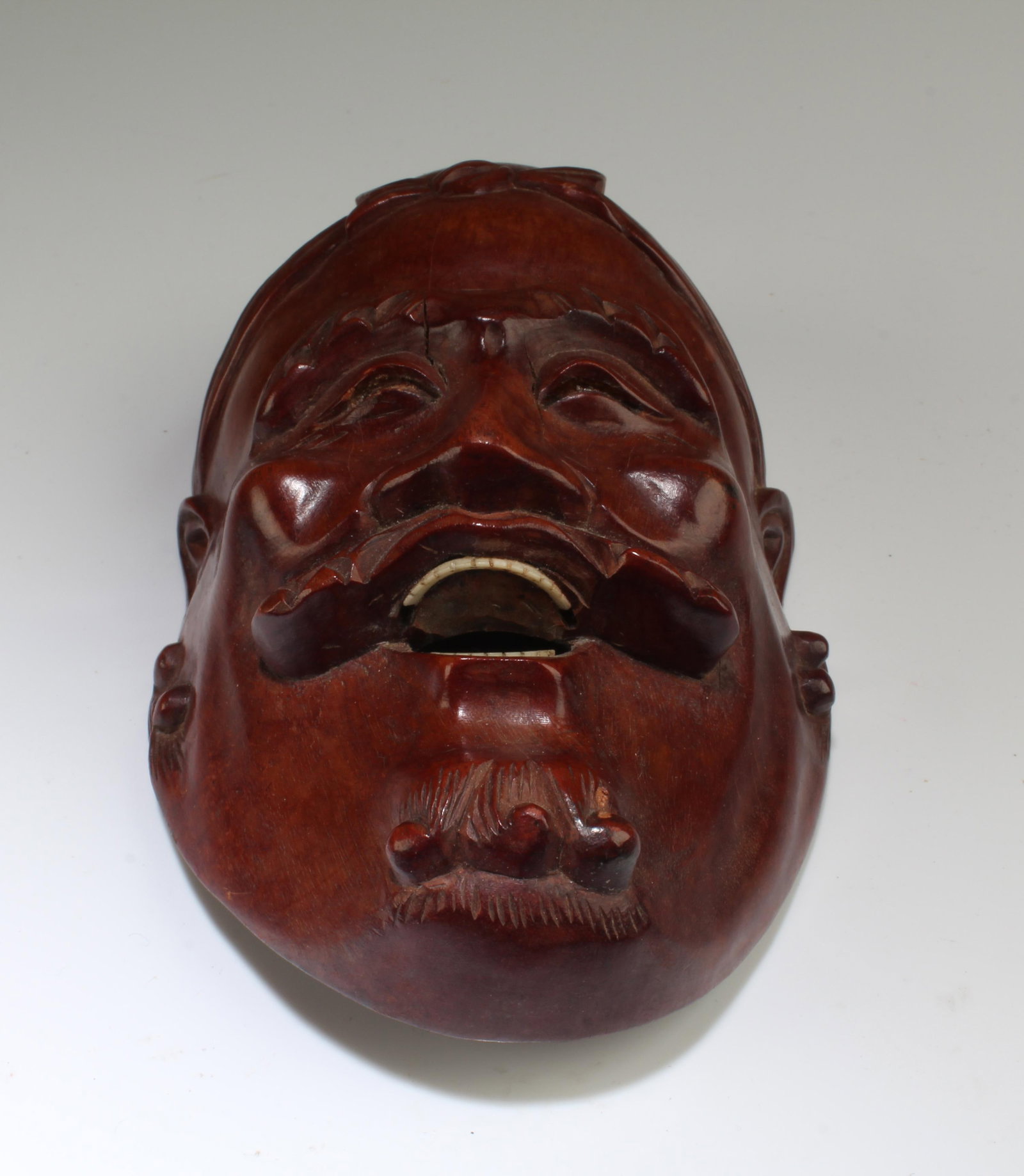 A Carved Wooden Face Mask Ornament (1 of 3)