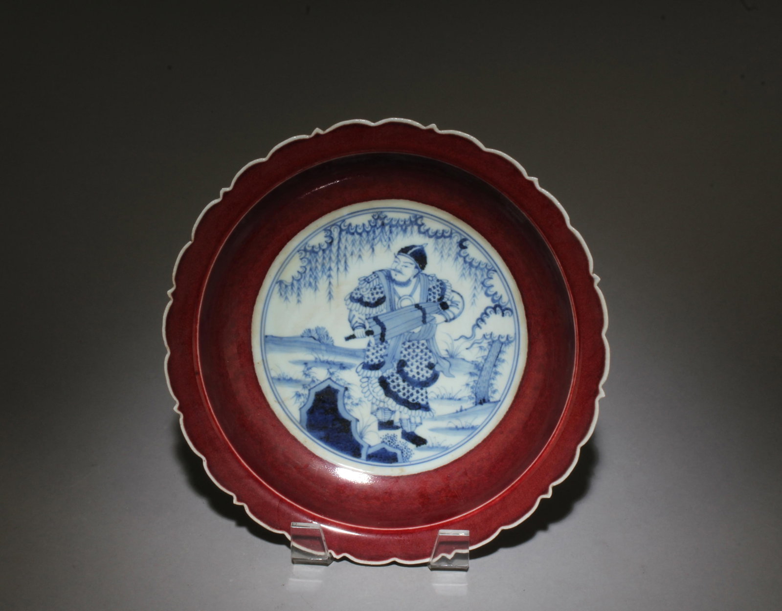 A Blue, White, and Red Figure Plate: A Blue, White, and Red Figure Plate. Dimensions: 8.75" x 2".