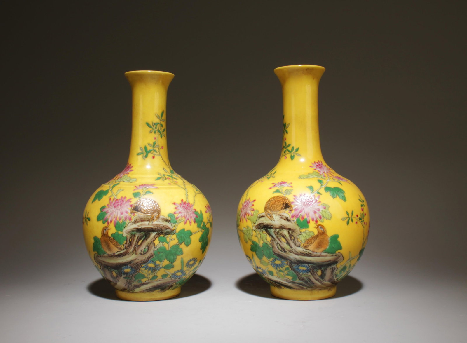 A Pair of Porcelain Vases with Bird and Flower: A Pair of Porcelain Vases with Bird and Flower Design Pattern. Dimensions: 4" x 7.25".