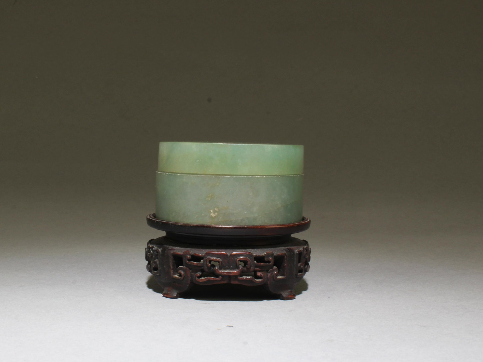 Antique Round Jade Box with Wooden Stand.: Antique Round Jade Box. Comes fitted with a wooden stand. Diameter: 2.25"