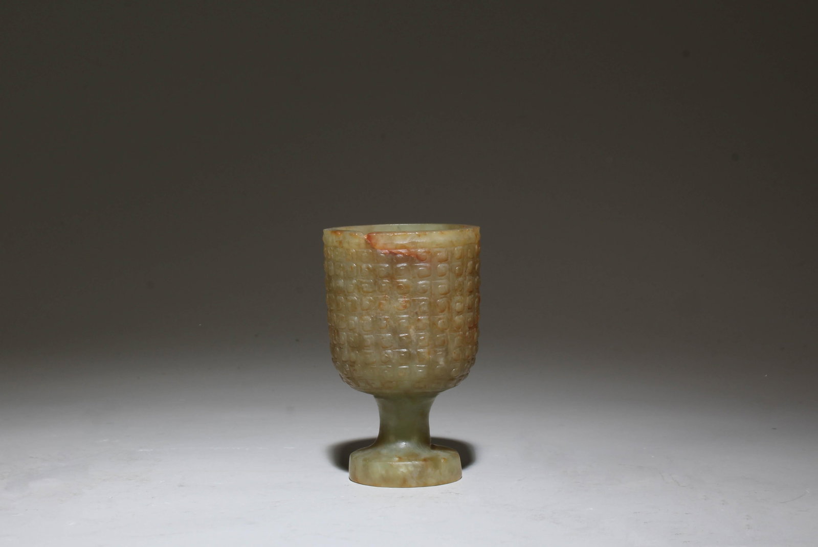 A Carved Jade Wine Cup: A Carved Jade Wine Cup. Height: 2.75"