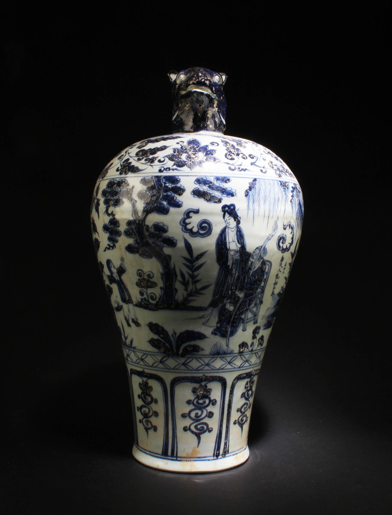 A Blue & White Porcelain Vase: A Blue & White Porcelain Vase, the top depicting a dog shaped head. Height: 19"