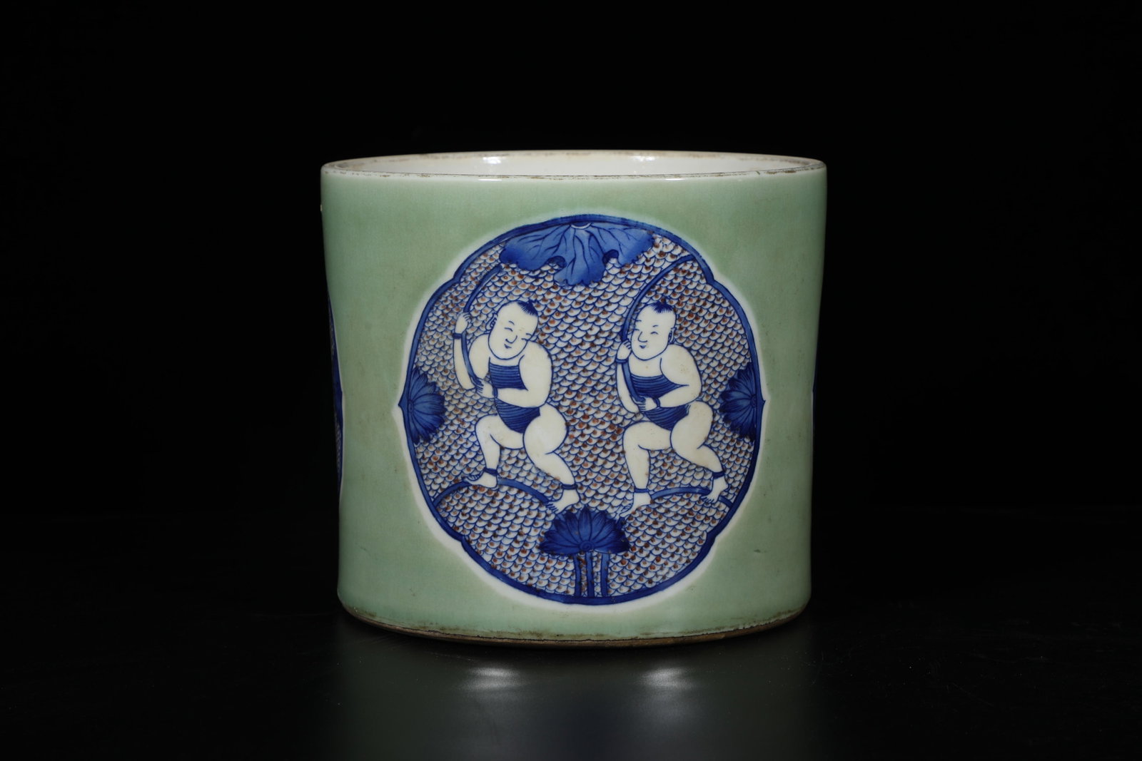 A Porcelain Brushpot: A Porcelain Brushpot. 'KangXi' mark at base. Height: 6.5" Diameter: 7.5"