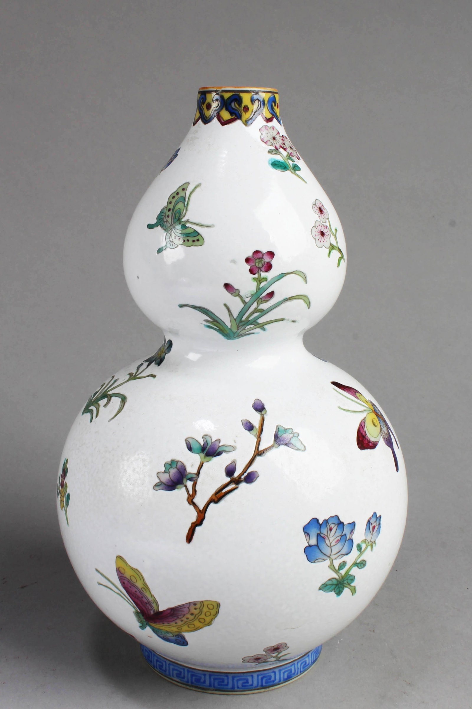 Chinese Flower Butterfly Pattern Double Gourd Vase: Chinese Porcelain Double Gourd Vase. 'QianLong' mark at base. Height: 9"