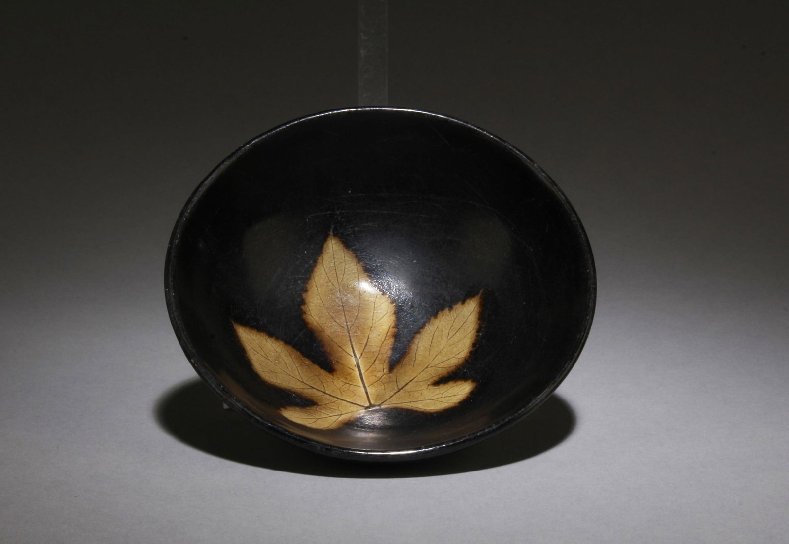 A Jianyao Tea Bowl: A Jianyao Tea Bowl. Dimensions: 4.5" x 1.5".