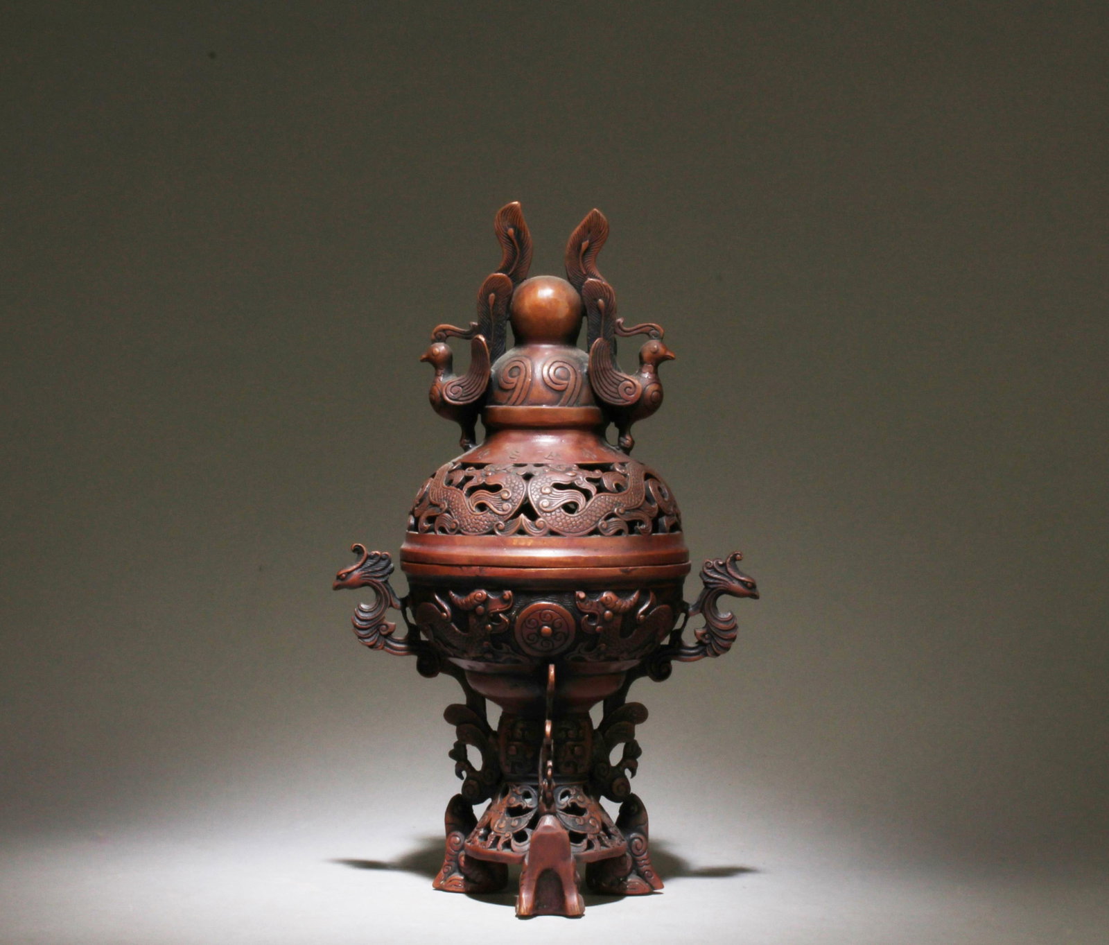 A Bronze Incense Burner: A Bronze Incense Burner. Dimensions: 11" x 7" x 4.75".