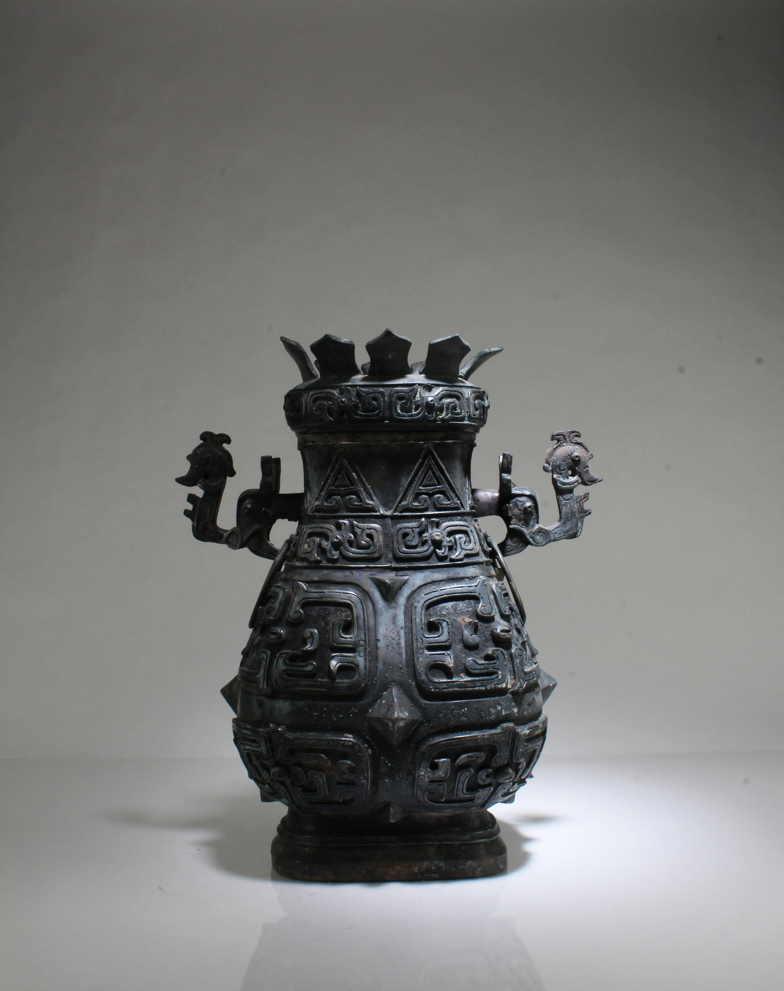 A Bronze Vase: A Bronze Vase with lid. Height: 13.5" Length( body): 11.5"