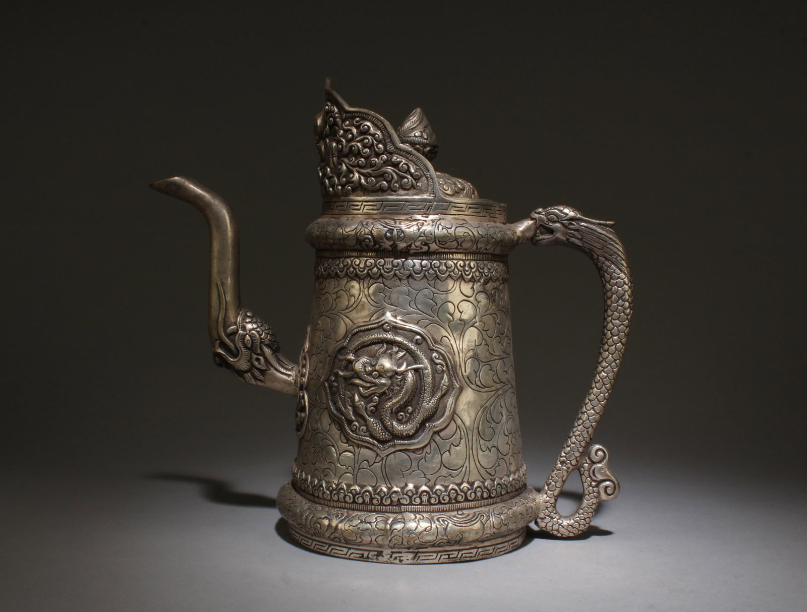A Silver-Plate Bronze Teapot: A Silver-Plate Bronze Teapot. Length: 9.25"