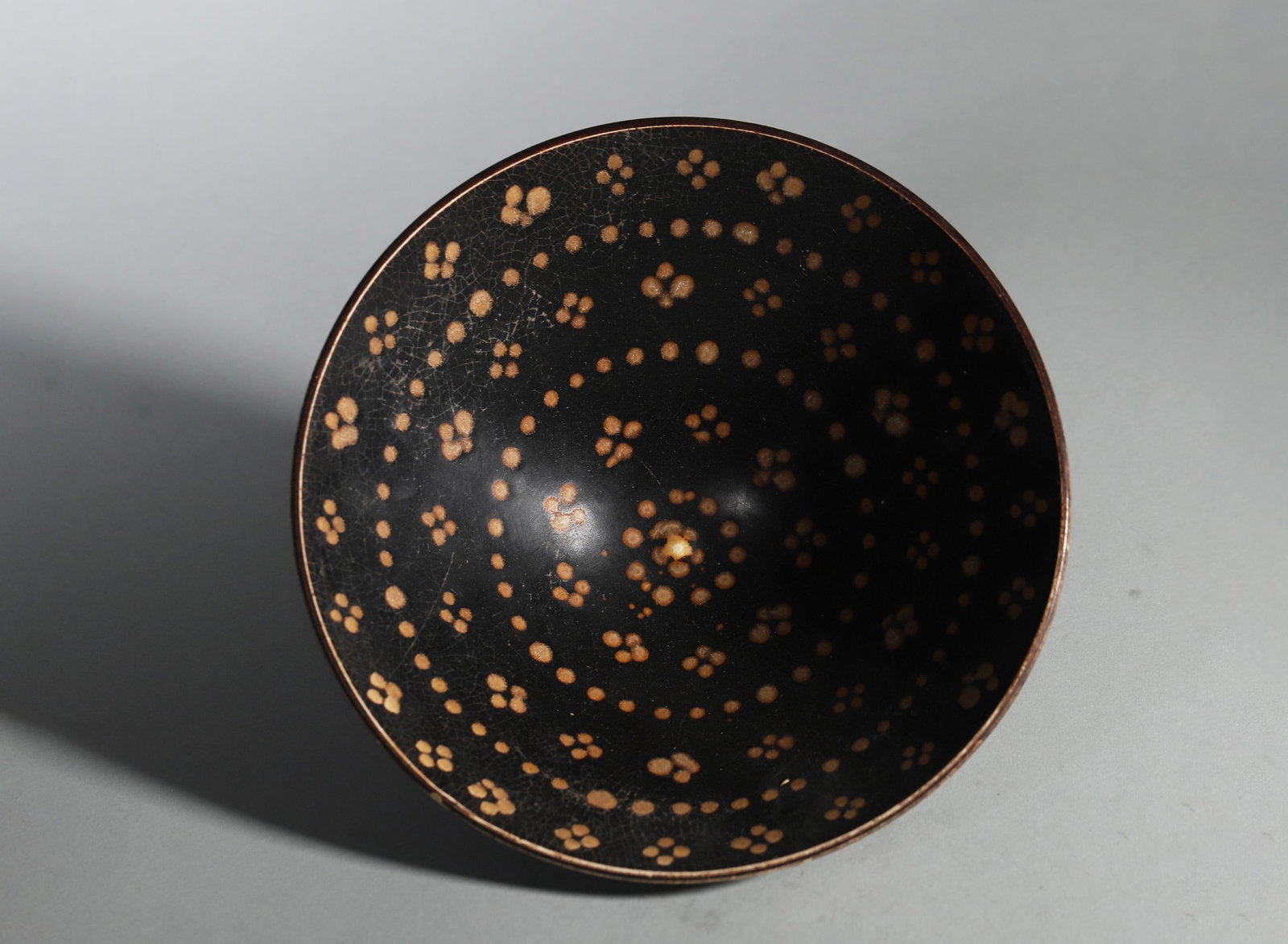 A Jizhou Kiln Black-Glazed Conical Tea Bowl with Star-Spot Decoration, Song Dynasty (1 of 5)