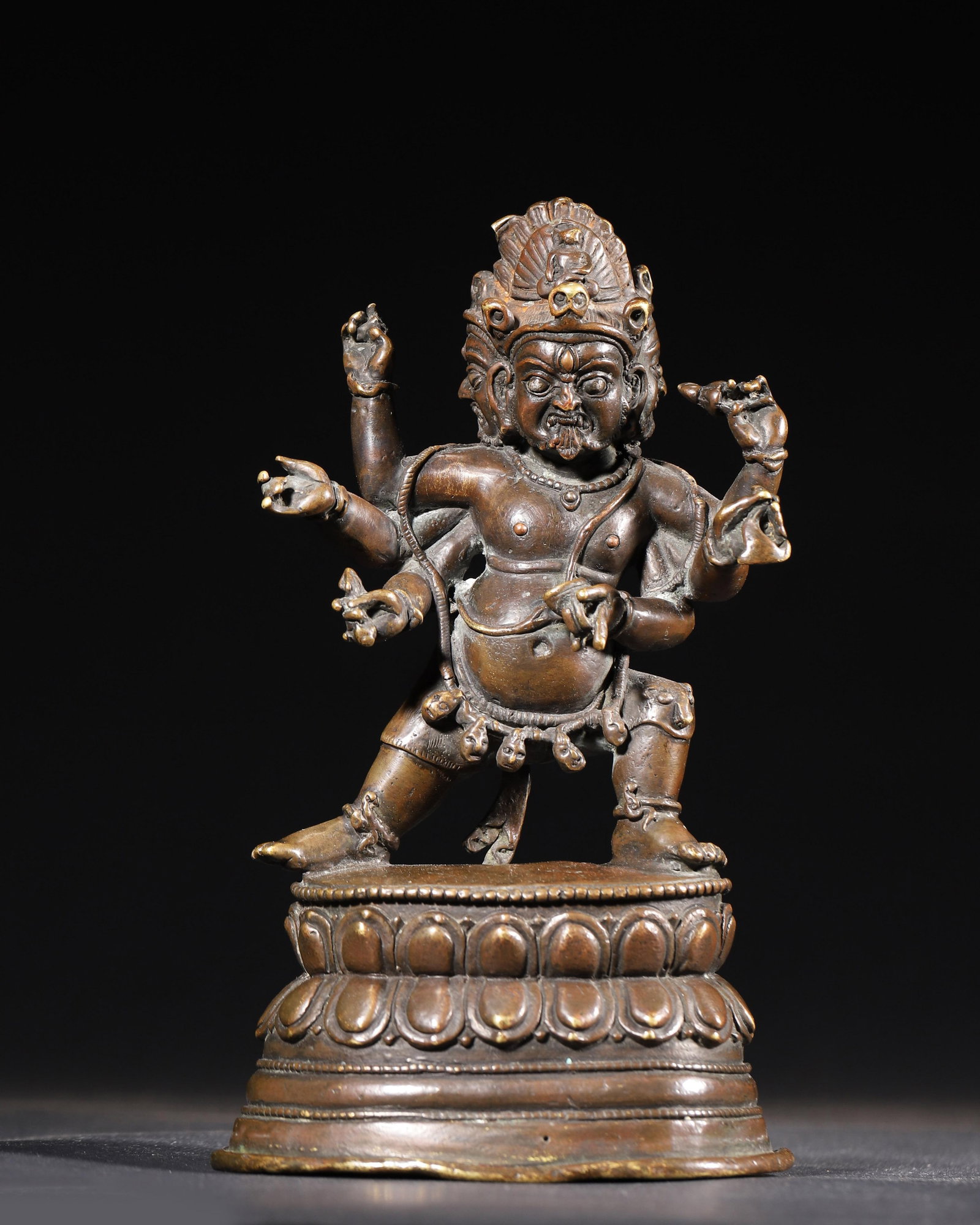 GILT-BRONZE FIGURE OF SIX-ARMED MAHAKALA, QING DYNASTY: 4.72" x 3.15" x 7.87" inches (12.0 cm x 8.0 cm x 20.0 cm) (Main) | Weight: 2.51 lbs (1140.0 g)A powerful gilt-bronze figure of Six-Armed Mahakala, Qing Dynasty. With fierce expression, exquisite craft