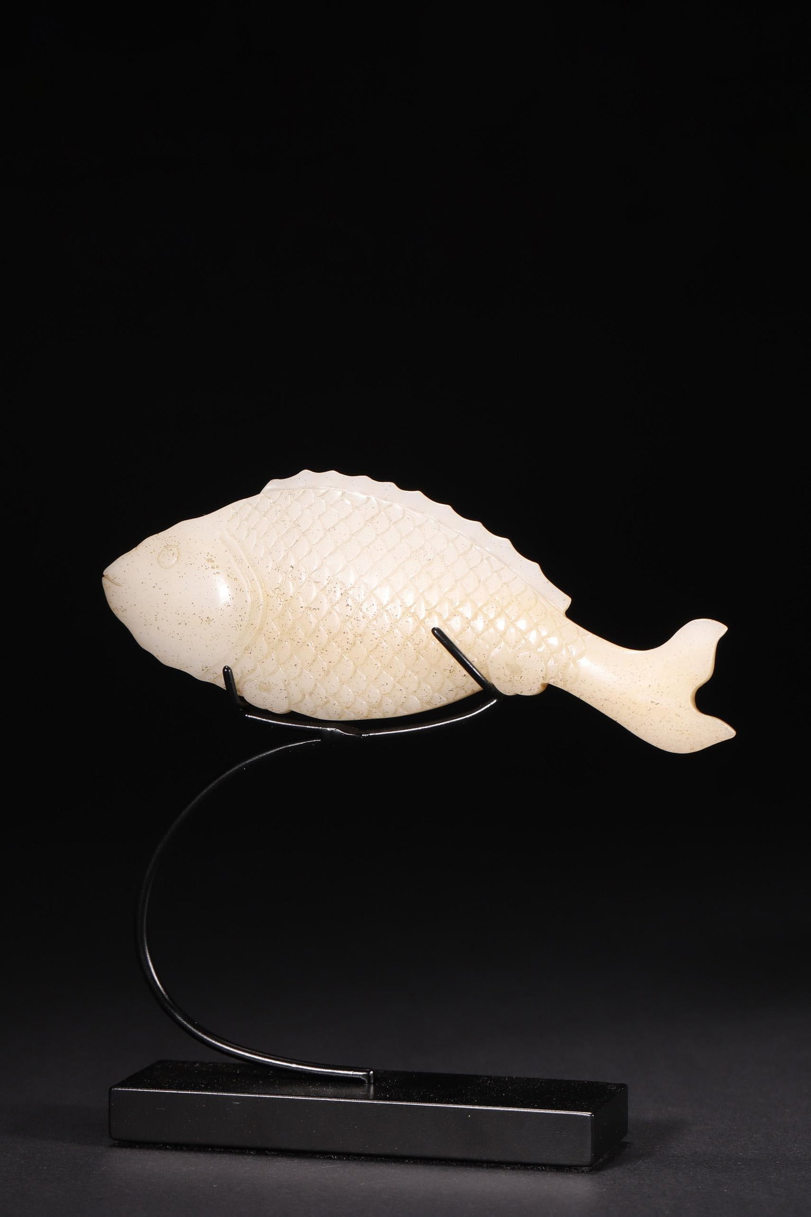 A - Hetian Jade Fish Pendant, Ming Dynasty: L 12cm (4.72 in); W 4.4cm (1.73 in); Wt 79g (0.17 lb)Carved from Hetian jade, this Ming Dynasty fish-shaped pendant features detailed scale carvings and natural patina. Symbolizing abundance, it is a 