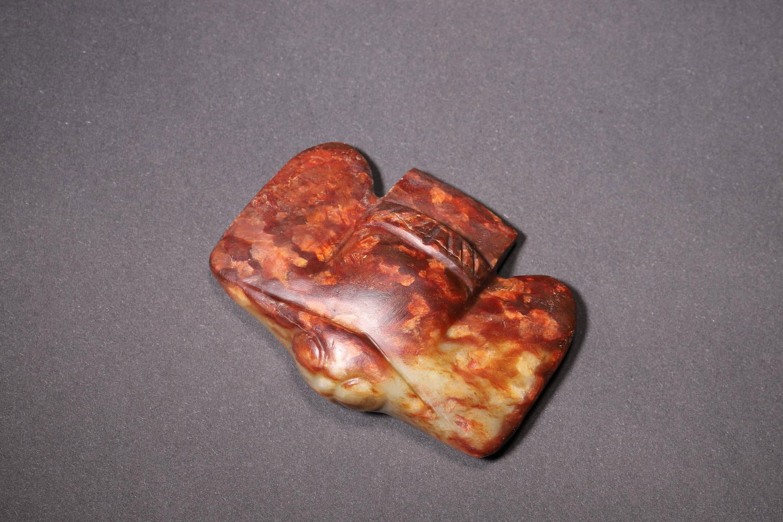A - Jade Owl Pendant, Hongshan Culture Period: L 7cm (2.76 in); W 5.5cm (2.17 in); Wt 98g (0.22 lb)A typical jade owl pendant of the Hongshan Culture, carved with simple lines, featuring spread wings, drilled holes on the reverse, and covered with