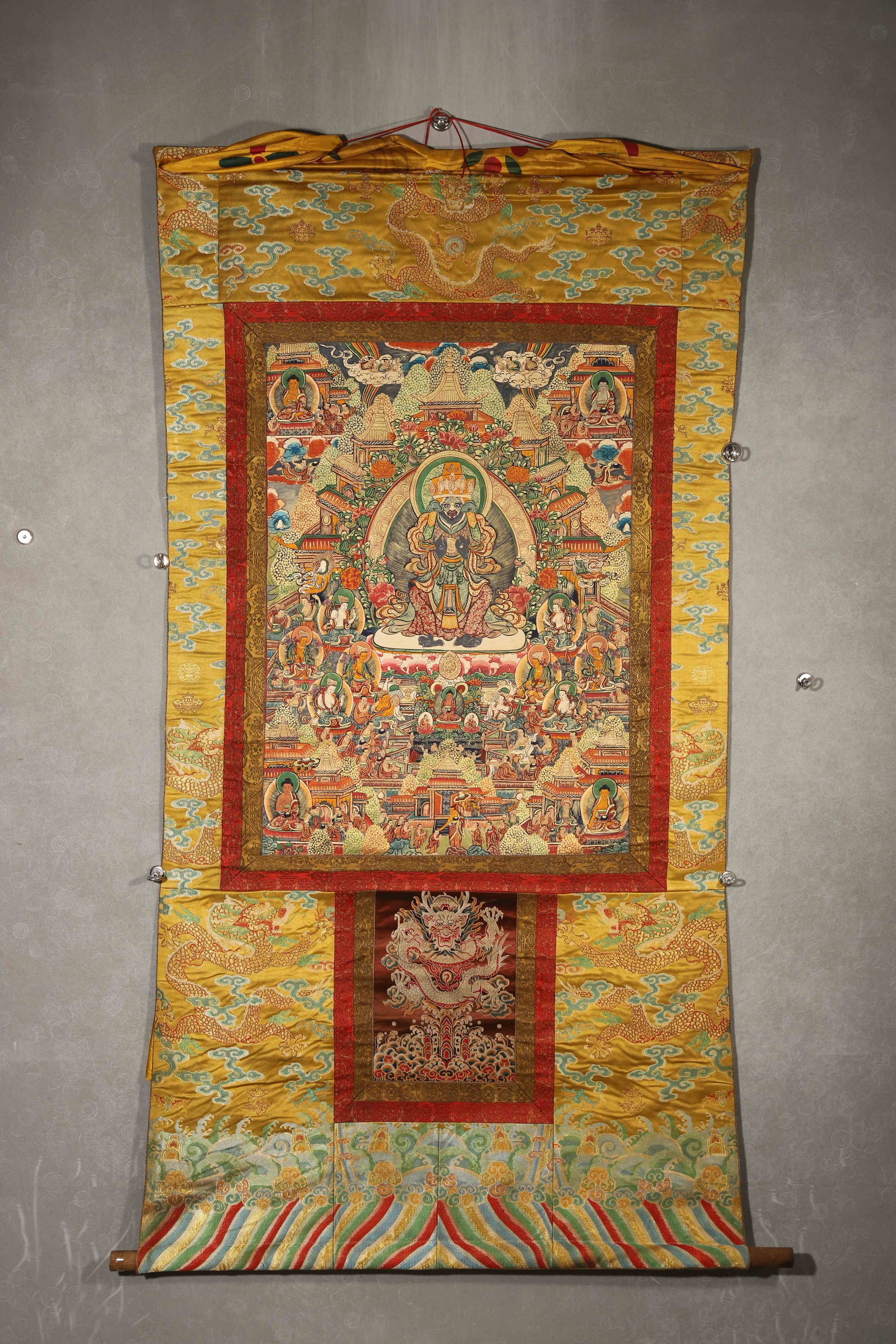 TIBETAN BUDDHIST THANGKA OF USNISA SITATAPATRA (IMPERIAL MOUNTING), 19TH CENTURY: 30.71in x 22.05in (78.0cm x 56.0cm)This 19th-century Tibetan Thangka depicts Usnisa Sitatapatra in a pure land, crafted with vivid mineral pigments and gilded details. Mounted in imperial-style brocad