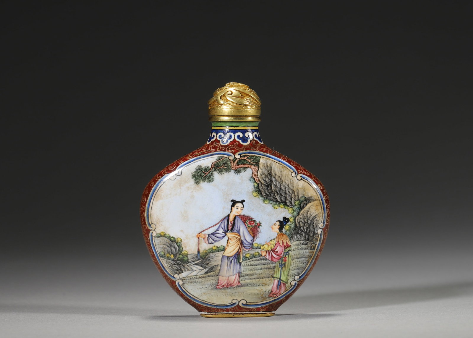 QIANLONG PERIOD, QING DYNASTY COPPER-BODIED ENAMEL SNUFF BOTTLE WITH FIGURAL MEDALLIONS: 2.09in x 2.56in (5.3cm x 6.5cm), 0.115lb (52.0g)A fine Qianlong period copper enamel snuff bottle with red gilt ground, figural medallions of court ladies, and gilt dragon lid. Marked "Qianlong Nian Z