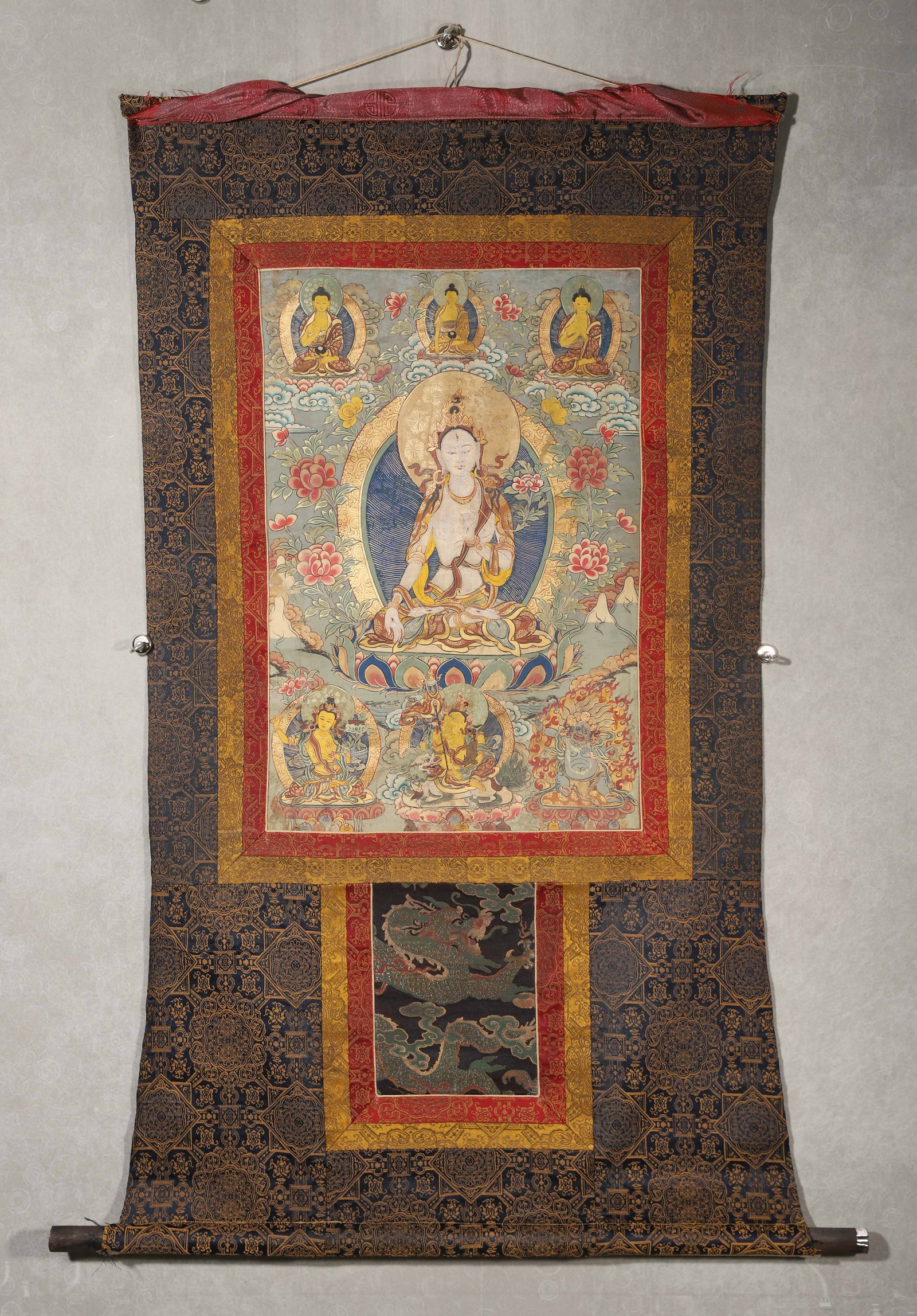 MID-18TH CENTURY, QING DYNASTY, A TIBETAN THANGKA OF WHITE TARA WITH INSCRIPTIONS AND HANDPRINTS: 26.77" x 17.72" inches (68.0 cm x 45.0 cm) (Main)Exquisitely painted in soft mineral pigments, this thangka depicts White Tara in a graceful seated posture, surrounded by Buddhas, bodhisattvas and