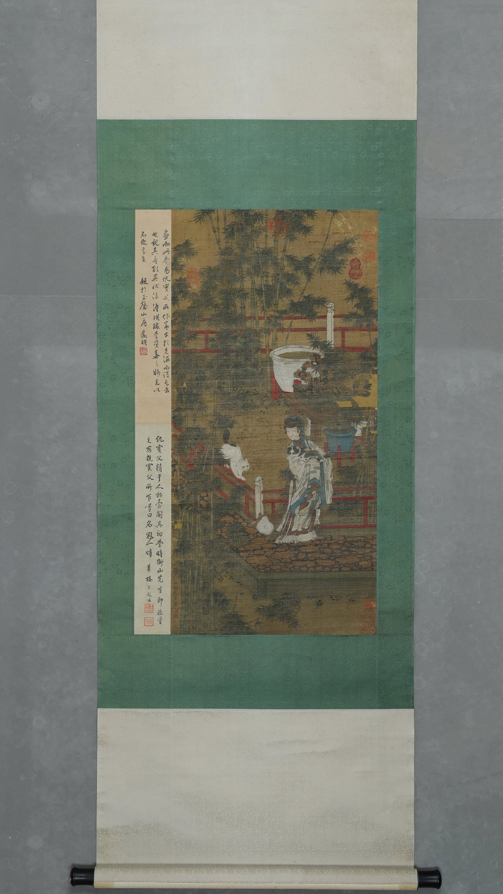 An Ink and Color Painting "Noble Lady Playing with Cats" on Silk, Attributed to Qiu Ying, Ming: Painting Core Size:L 84cm (33.07 in); W 41cm (16.14 in)A Ming Dynasty hanging scroll on old silk, depicting a noble lady playing with cats in a bamboo courtyard, attributed to Qiu Ying. With delicate 
