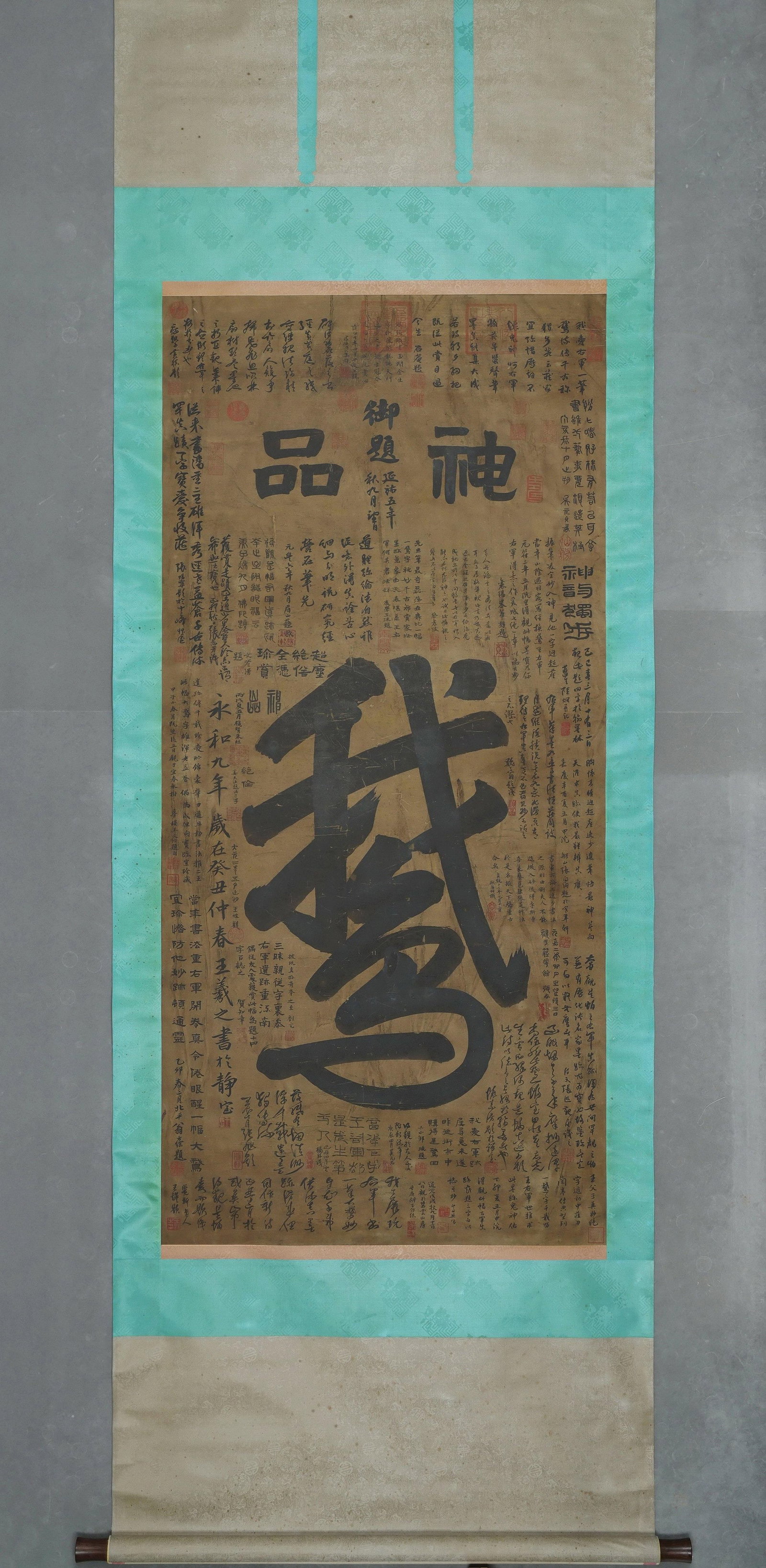 An Old Silk Calligraphy "E (Goose)" Attributed to Wang Xizhi, Jin Dynasty, Hanging Scroll, with: Painting Core SizeL 145cm (57.09 in); W 70cm (27.56 in)A Jin Dynasty hanging scroll on old silk, featuring the character "E (Goose)" attributed to Wang Xizhi. With bold, powerful brushwork, it is surr