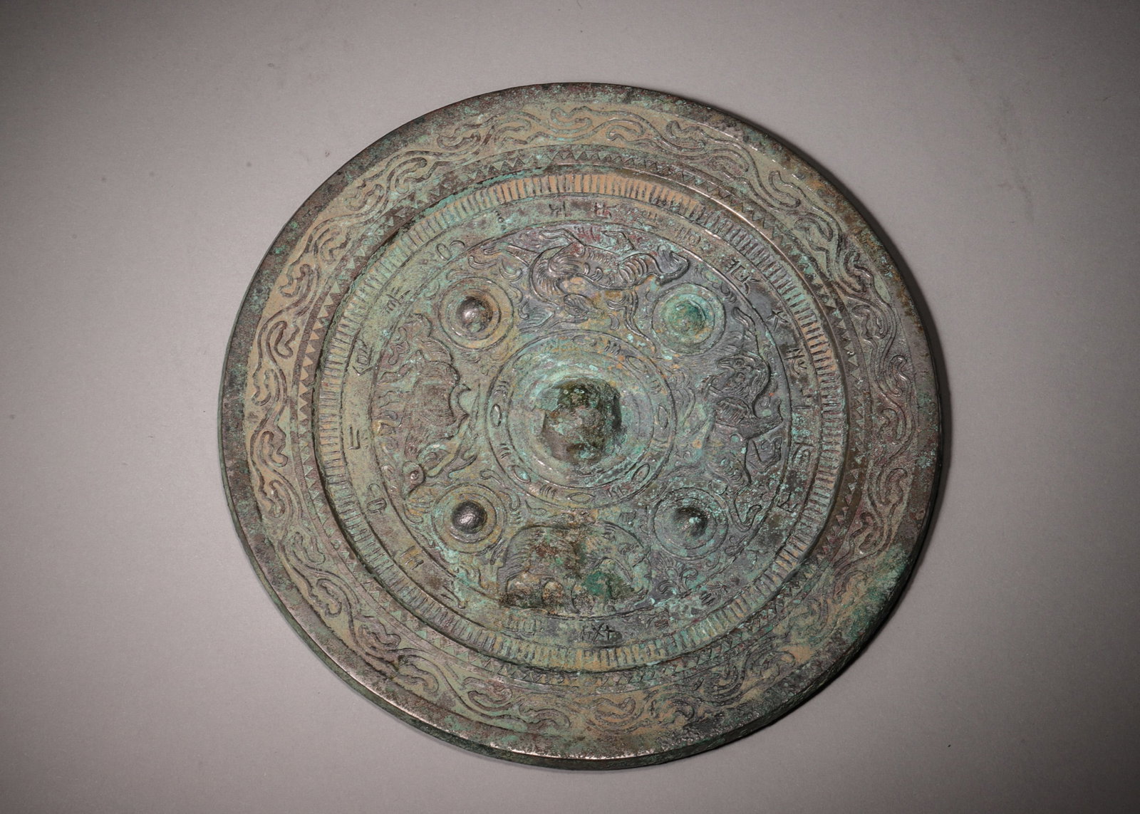 A Bronze Mirror with Four Nipples, Divine Beasts and Inscriptions, Han Dynasty (1 of 6)