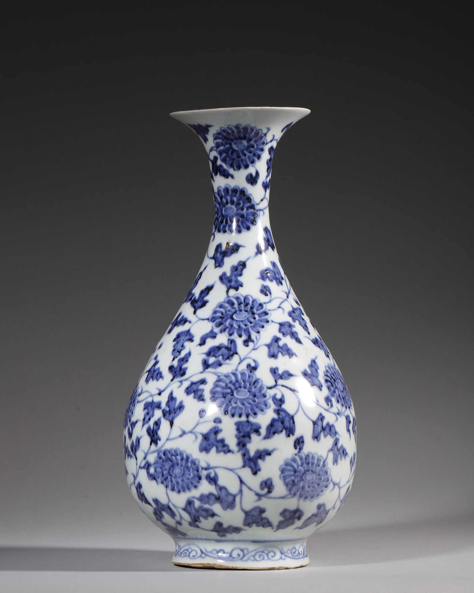 A BLUE AND WHITE YUHUCHUN VASE WITH INTERLOCKING CHRYSANTHEMUM DESIGN, YUAN DYNASTY: W 14cm (5.51 in); H 27cm (10.63 in),A Yuan dynasty blue and white pear-shaped vase with sand foot, fully painted with interlocking chrysanthemums, dark cobalt with iron spots, accompanied by scroll gr