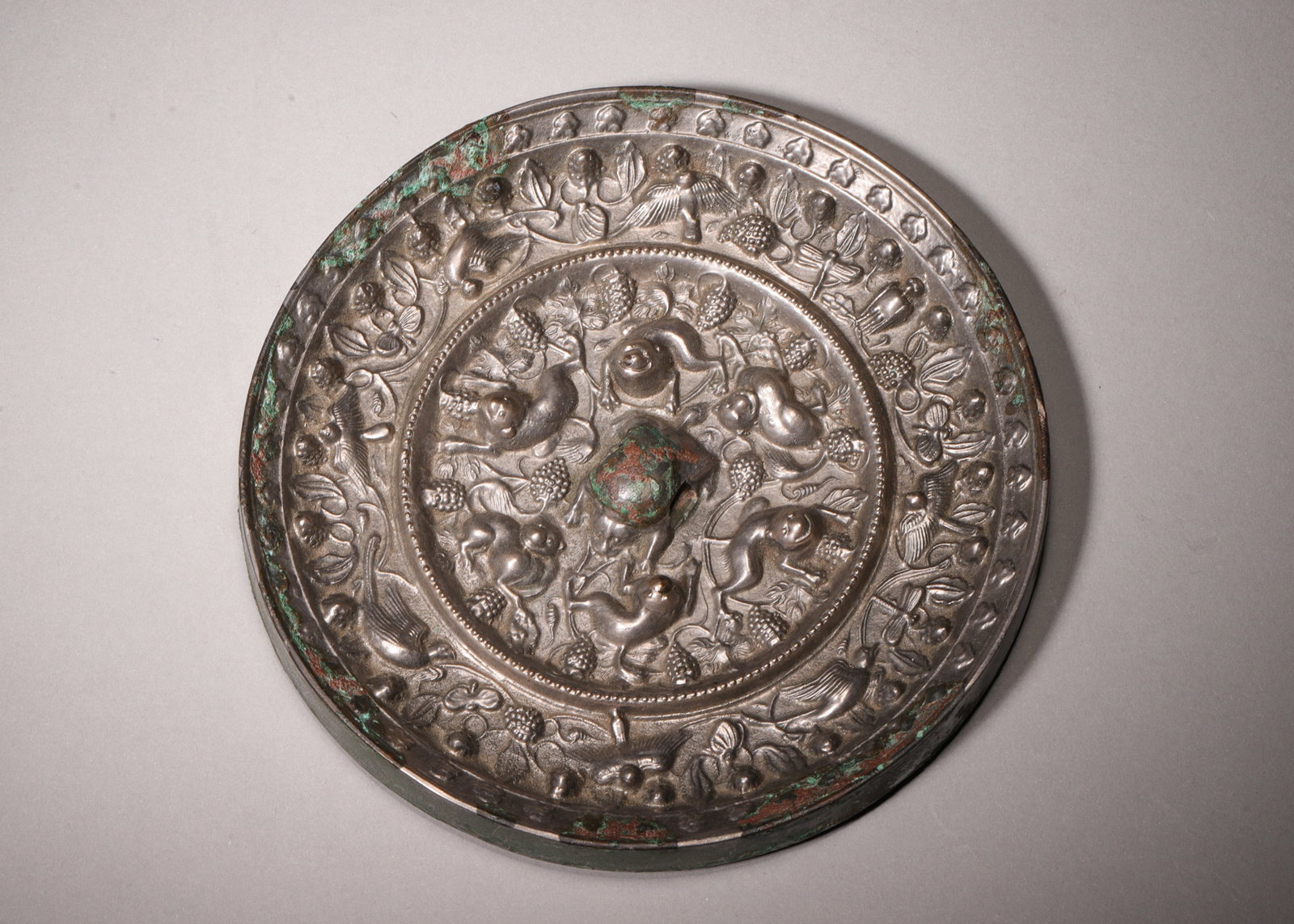 A Bronze Mirror with Sea Beasts and Grape Vines Pattern, Tang Dynasty (1 of 6)