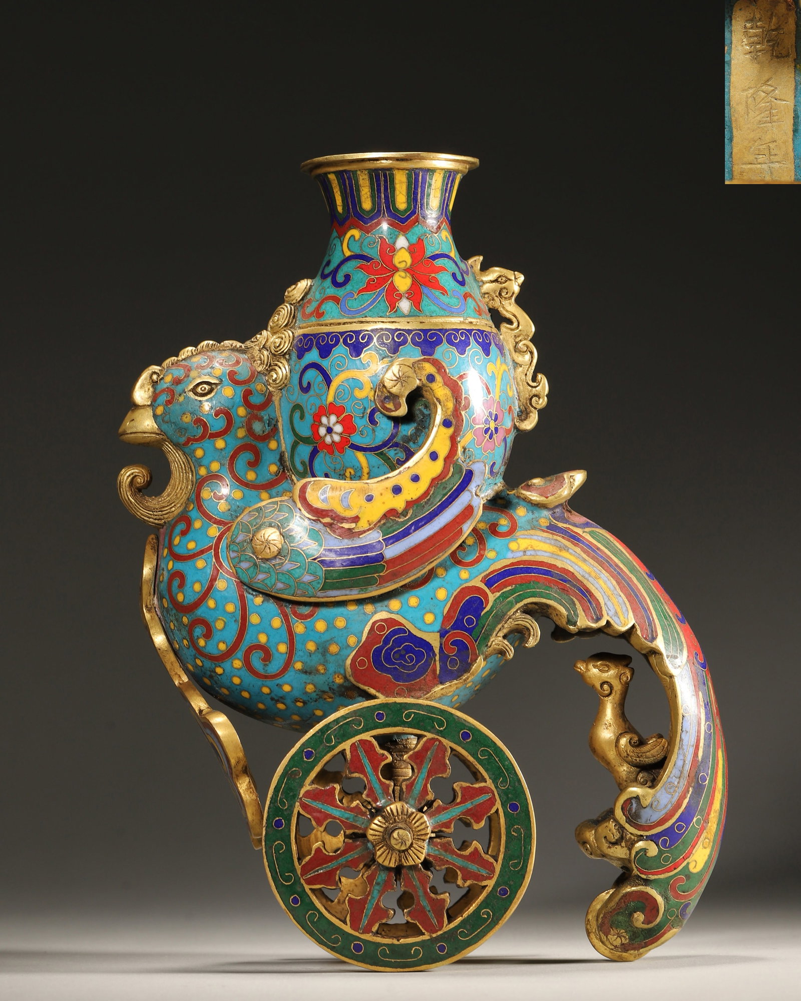 Qing Dynasty, Qianlong Mark, Cloisonne Enamel on Copper Gourd-Shaped Vase with Phoenix Chariot: Length 16.0cm (6.3in), Width 8.0cm (3.15in), Height 22.0cm (8.66in), Weight 2530.0g (5.58lb)Important imperial artifact made by the Imperial Workshop. The shape is a phoenix driving a cart carrying a 