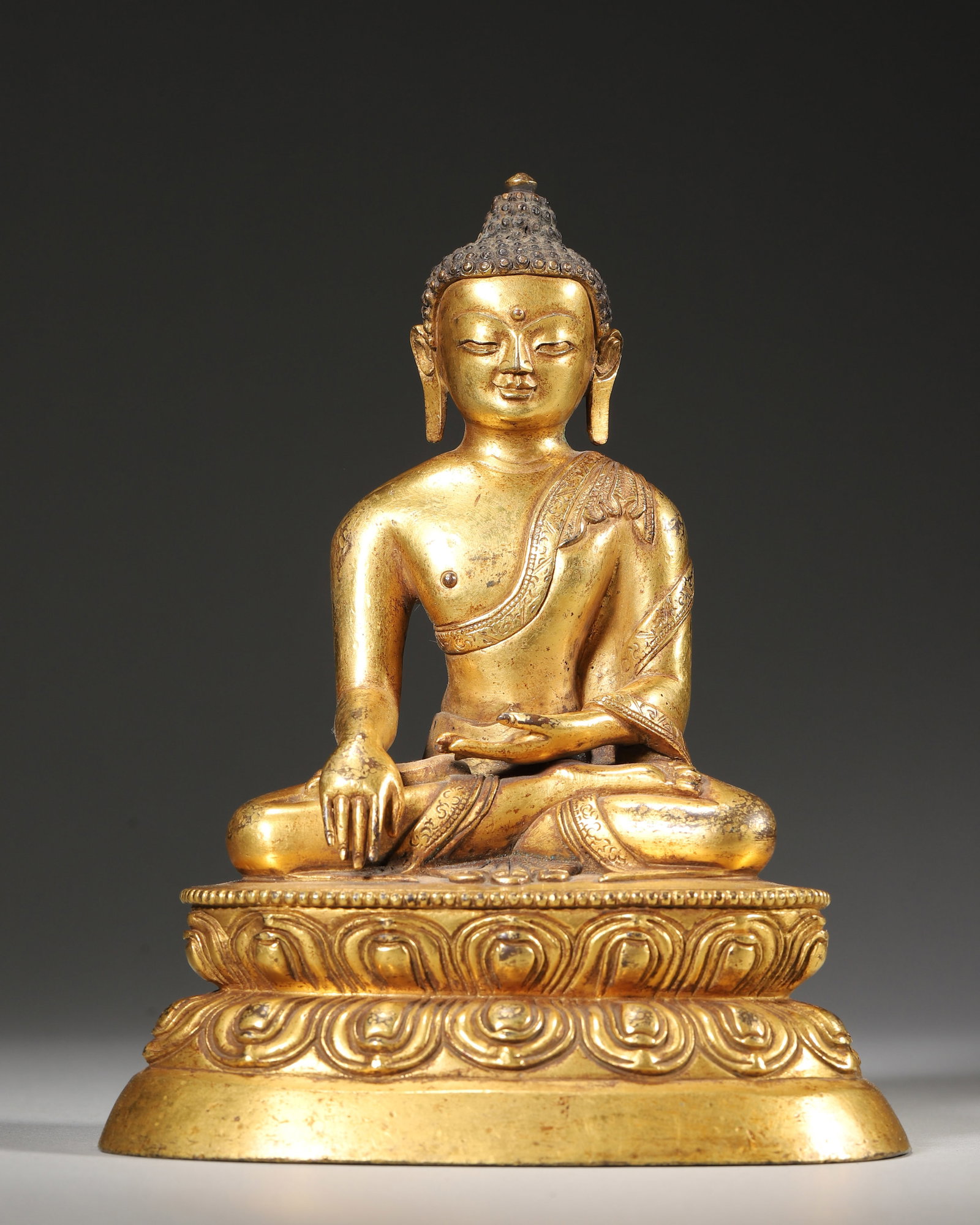 A Gilt-bronze seated statue of Sakyamuni,Qing Dynasty, (1 of 9)