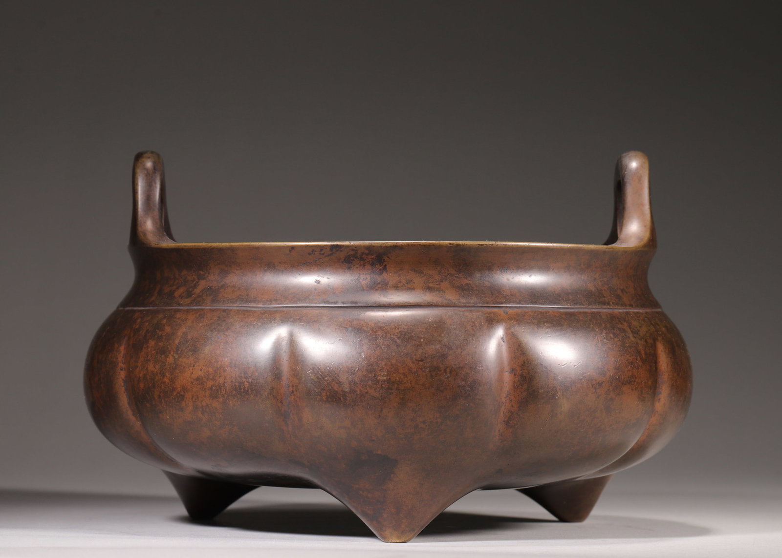 A Bronze Tripod Censer in Melon-Ribbed Form with Upright Handles, Marked "Da Ming Xuan De Nian Zhi", (1 of 9)