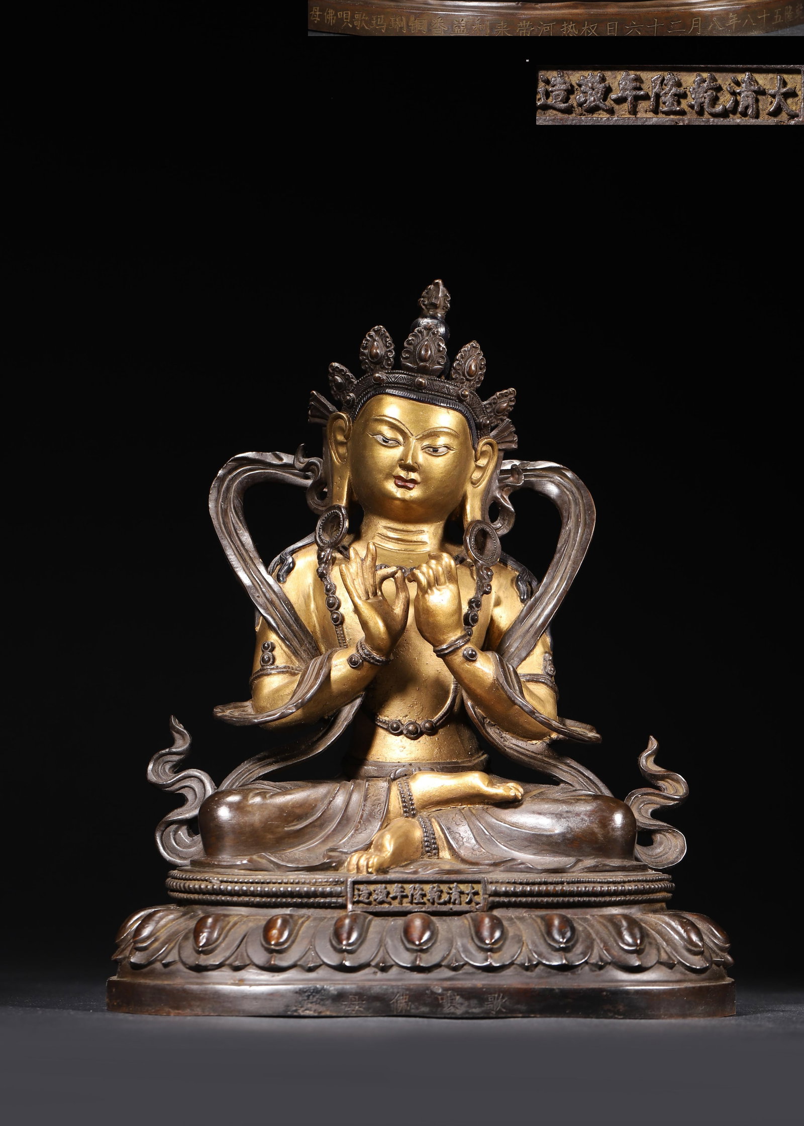 IMPERIAL QIANLONG PERIOD, QING DYNASTY GILT-BRONZE STATUE OF GAWGYI BUDDHA MOTHER (WITH QIANLONG: 8.66 x 5.91 x 11.02 in (22 x 15 x 28 cm), 9.05 lbs (4106 g)An imperial Qianlong-period gilt-bronze seated statue of Gawgyi Buddha Mother, with a serene expression and flowing scarves. Bearing the impe