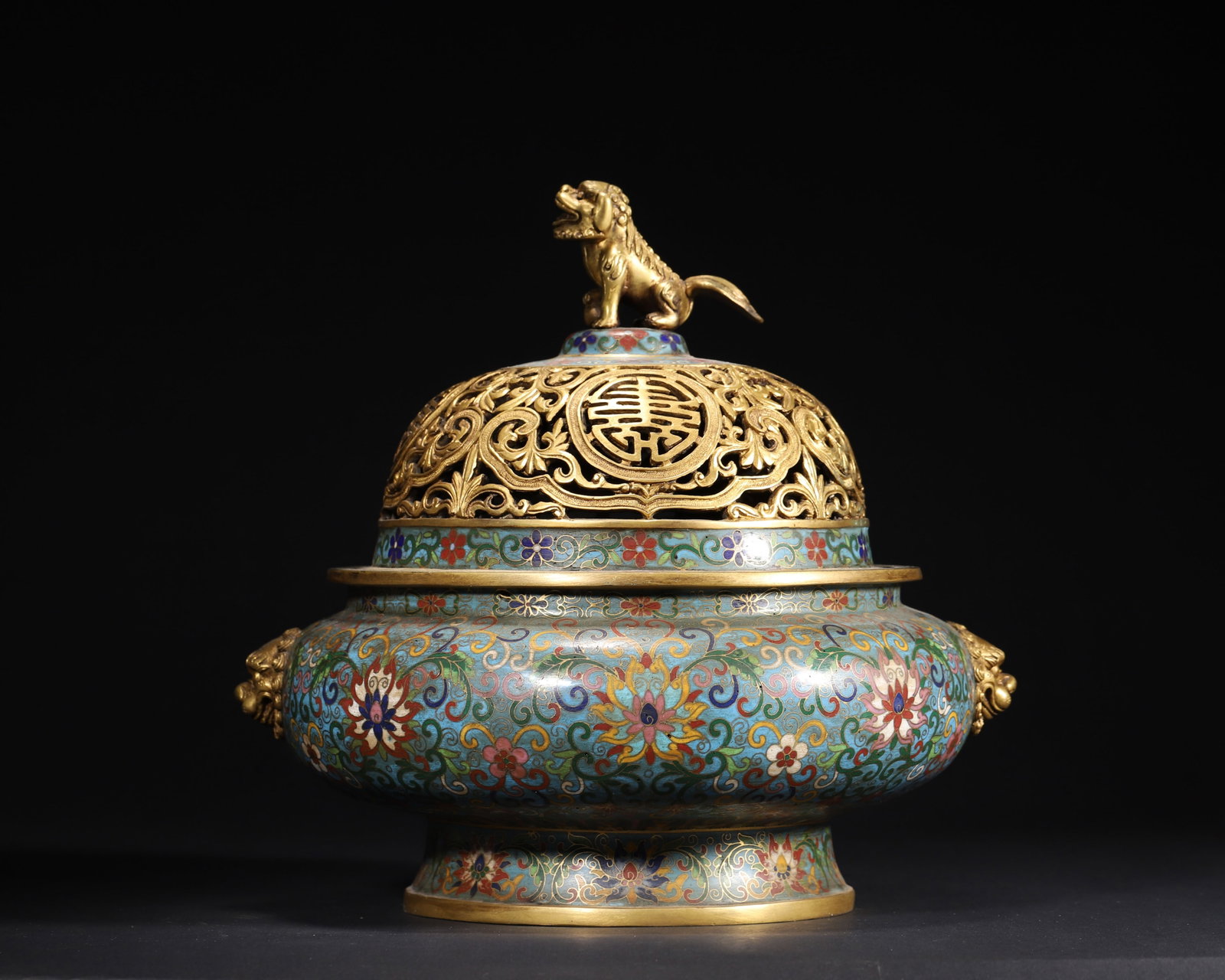 Qing Qianlong Period Cloisonne Enamel Censer with Shou Motif & Lion Knob: Diameter 29.0cm (11.42in), Height 25.0cm (9.84in), Weight 7583.0g (16.72lb)Qing Qianlong imperial cloisonne censer, gilt-bronze body, lion knob & openwork "Shou" lid, decorated with floral motifs, vib