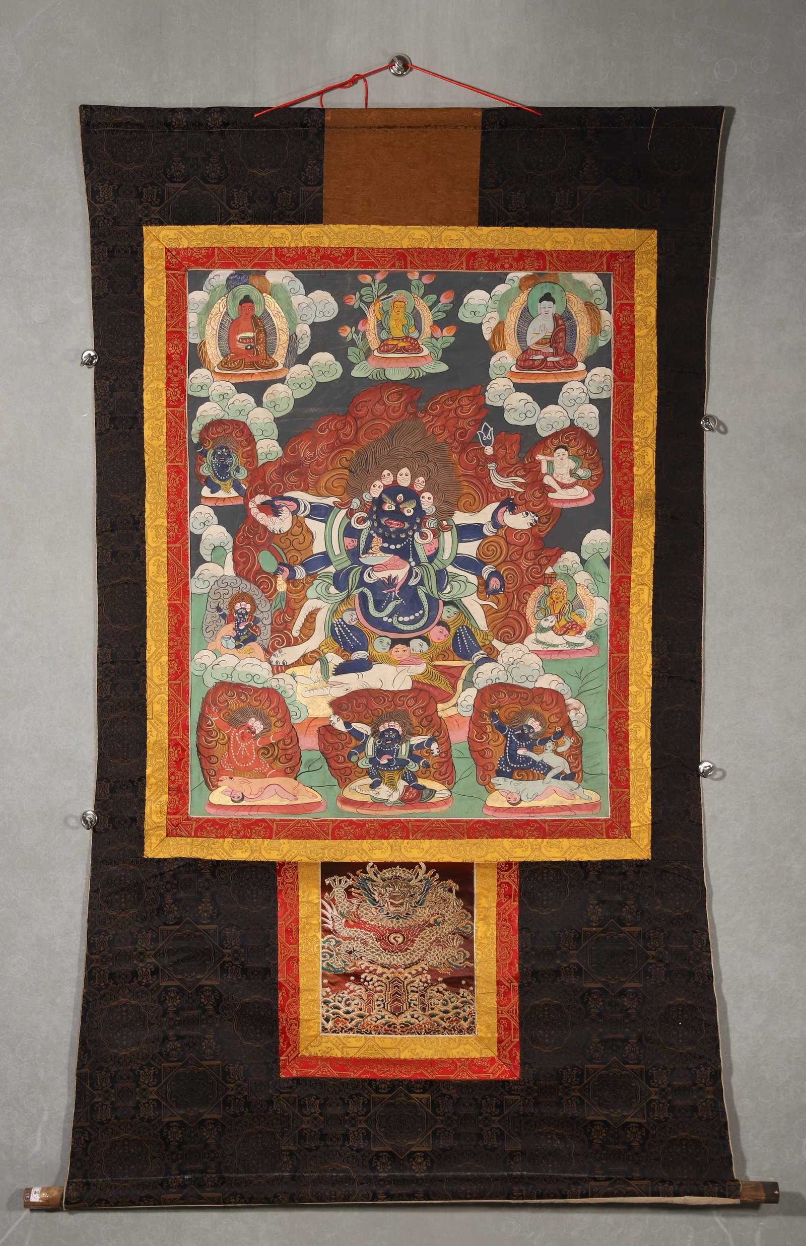 LATE 19TH CENTURY, QING DYNASTY, A TIBETAN THANGKA OF SIX-ARMED MAHAKALA: 30.31" x 23.62" inches (77.0 cm x 60.0 cm) (Main)Painted with mineral pigments on a black ground, this thangka depicts the Six-Armed Mahakala in a majestic posture with flaming aureole. Well-preserved