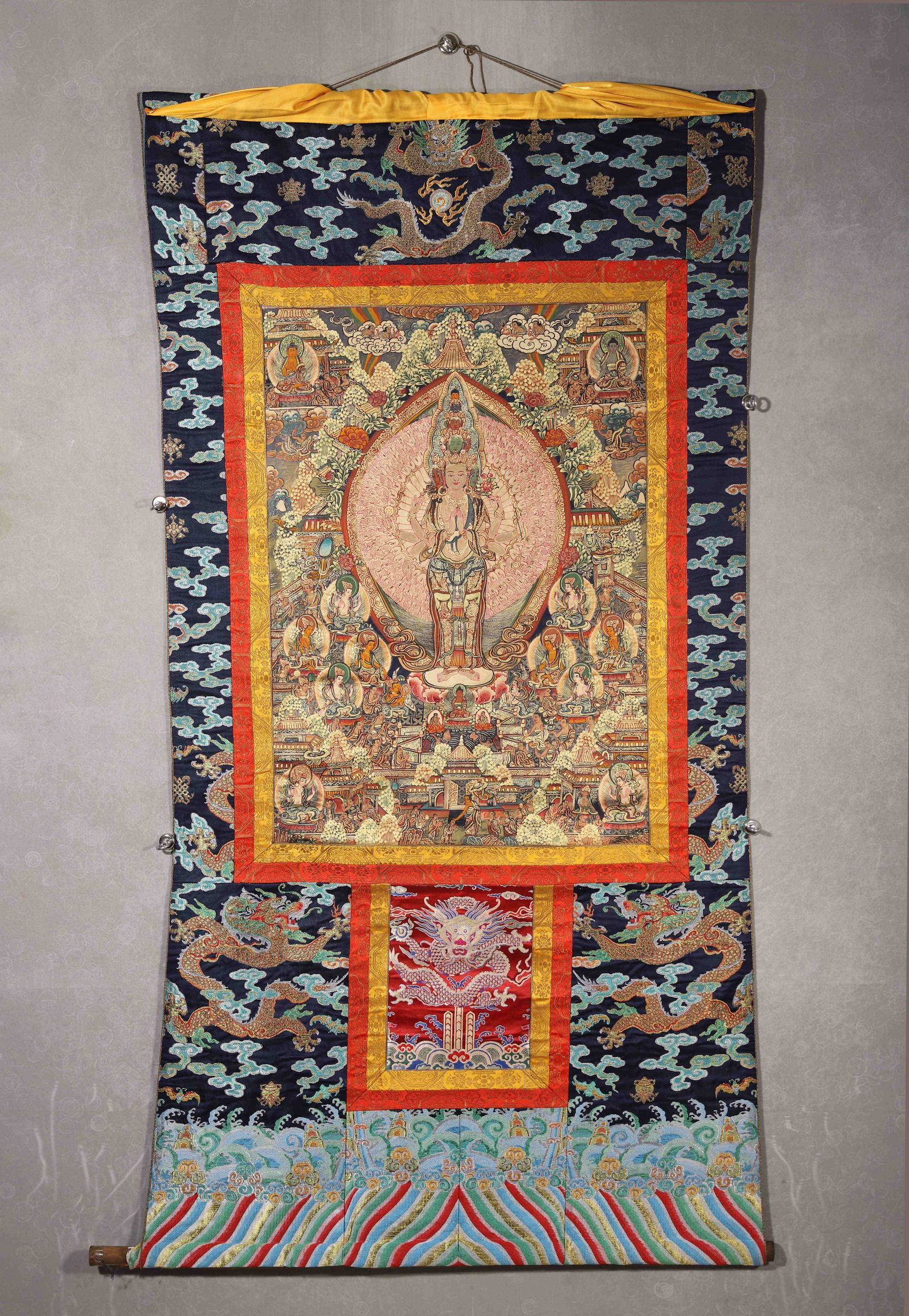 QING DYNASTY, A FINE TIBETAN THANGKA OF THOUSAND-ARMED AVALOKITESHVARA MANDALA, WITH MOUNTING AND: 31.89" x 22.44" inches (81.0 cm x 57.0 cm) (Main)This 18th-19th century Tibetan thangka is painted with mineral pigments, depicting Thousand-Armed Avalokiteshvara on a lotus pedestal, surrounded by Bu