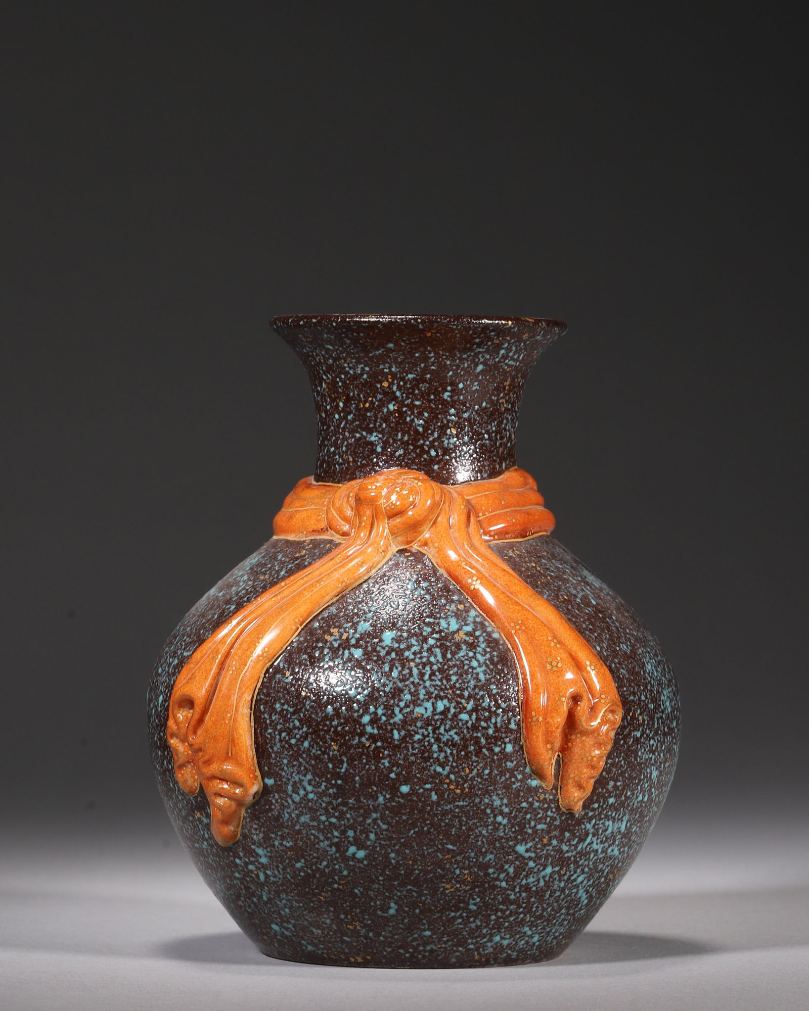 A ROBIN'S EGG GLAZE PORCELAIN VASE WITH GILT CORAL RED RIBBON, QIANLONG PERIOD, QING DYNASTY: H 13.00cm (5.12 in); D 10.00cm (3.94 in),Qianlong marked vase covered with robin's egg speckled glaze with gold dust. Relief coral red gilt ribbon wrapped around neck, classic imperial decorative porc