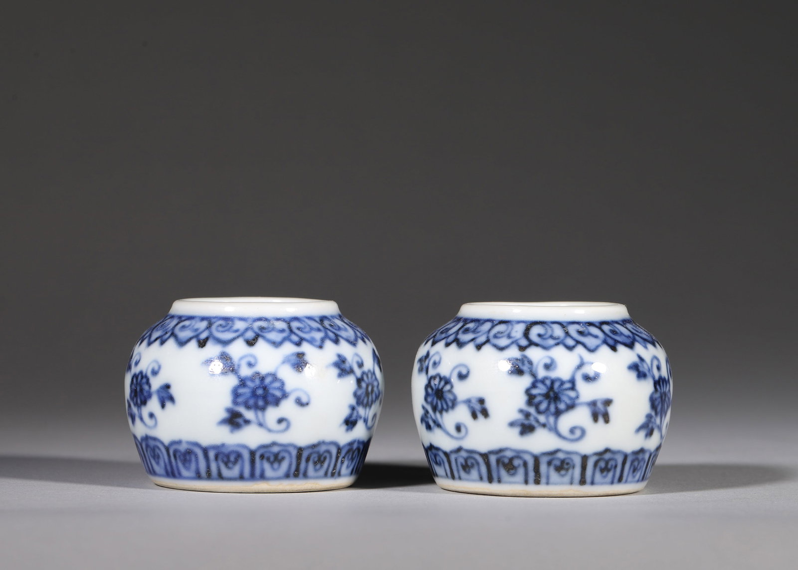 A PAIR OF BLUE AND WHITE FLORAL WATER COUPES, XUANDE PERIOD MING DYNASTY (1 of 8)