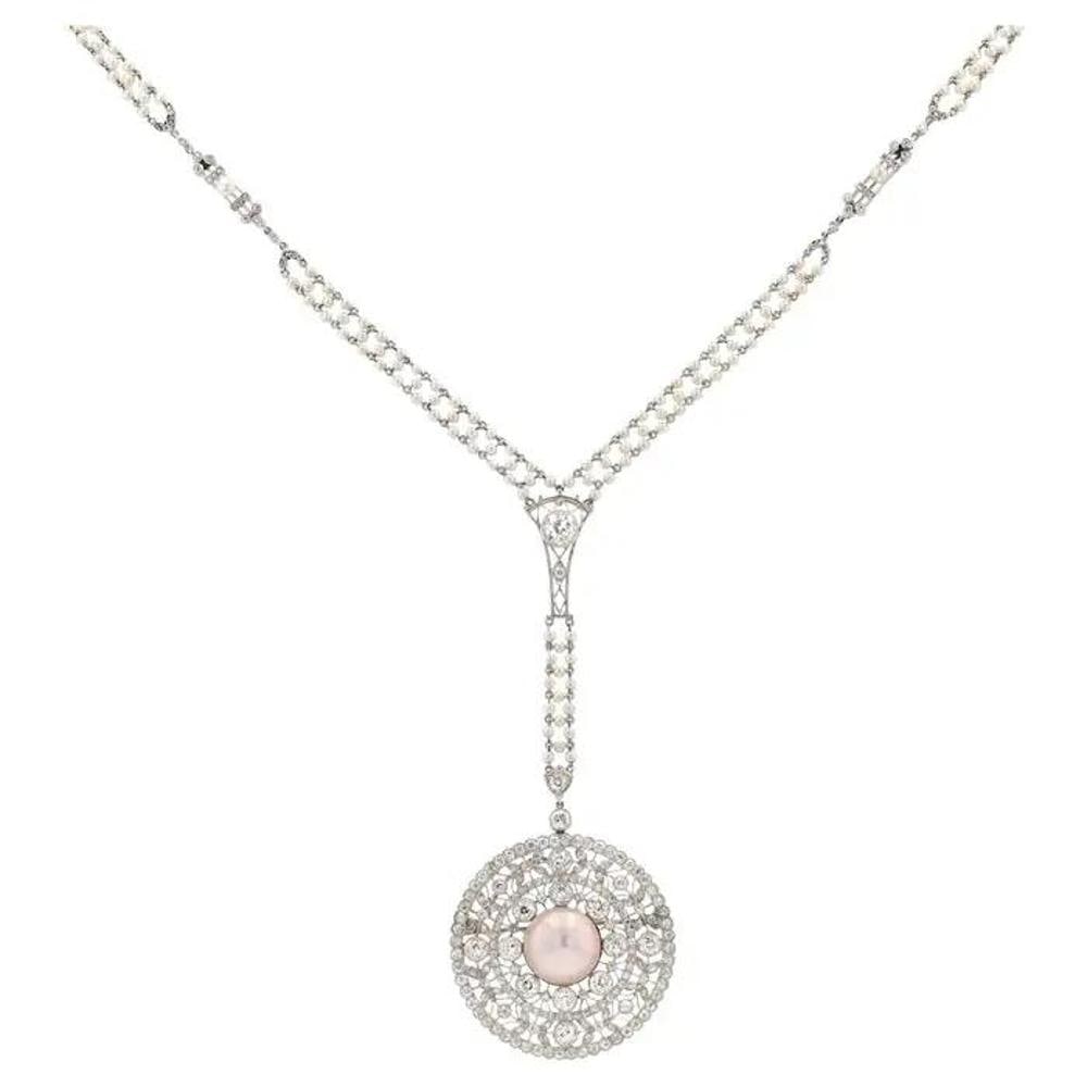 Edwardian 6 Carat Diamond & Pearl Platinum Sautoir Conversion Necklace: EDWARDIAN 6 CARAT DIAMOND & PEARL PLATINUM SAUTOIR CONVERSION NECKLACE Description: This exquisite pendant exudes the charm and romance of the Edwardian era. It is elegant and captivating, with a bril
