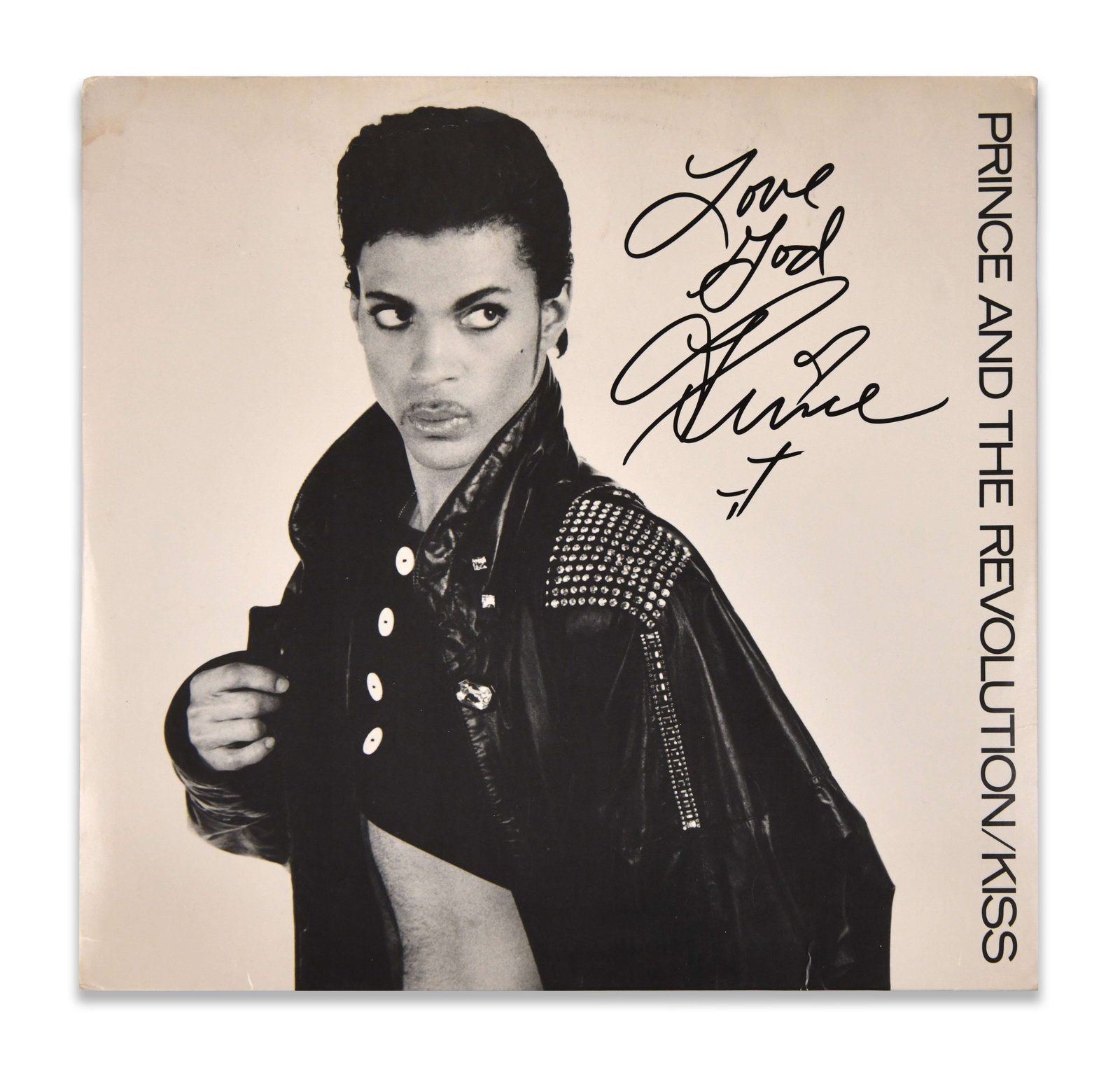 PRINCE - Signed Kiss (Prince and the Revolution, 1986) 12-inch Single Display: PRINCE - SIGNED KISS (PRINCE AND THE REVOLUTION, 1986) 12-INCH SINGLE DISPLAY Dimensions: Vinyl records Size 12 1/4 x 12 1/6 in Provenance and Authenticity: The sleeve is signed by Prince in bold blac