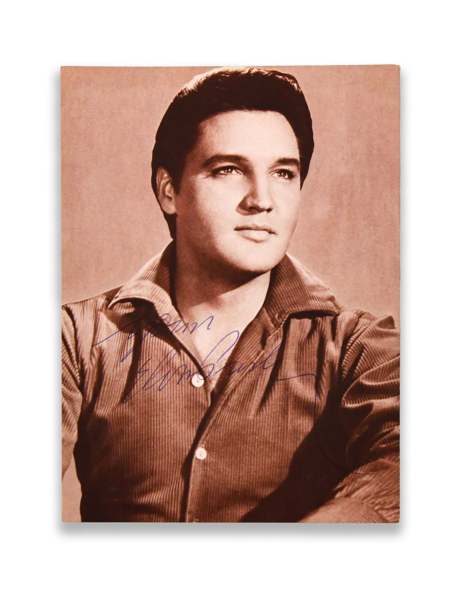 ELVIS PRESLEY - Signed Photographic Postcard: ELVIS PRESLEY - SIGNED PHOTOGRAPHIC POSTCARD Provenance and Authenticity: The postcard bears a bold blue ink signature reading "Elvis Presley," applied across the lower portion of the portrait. The