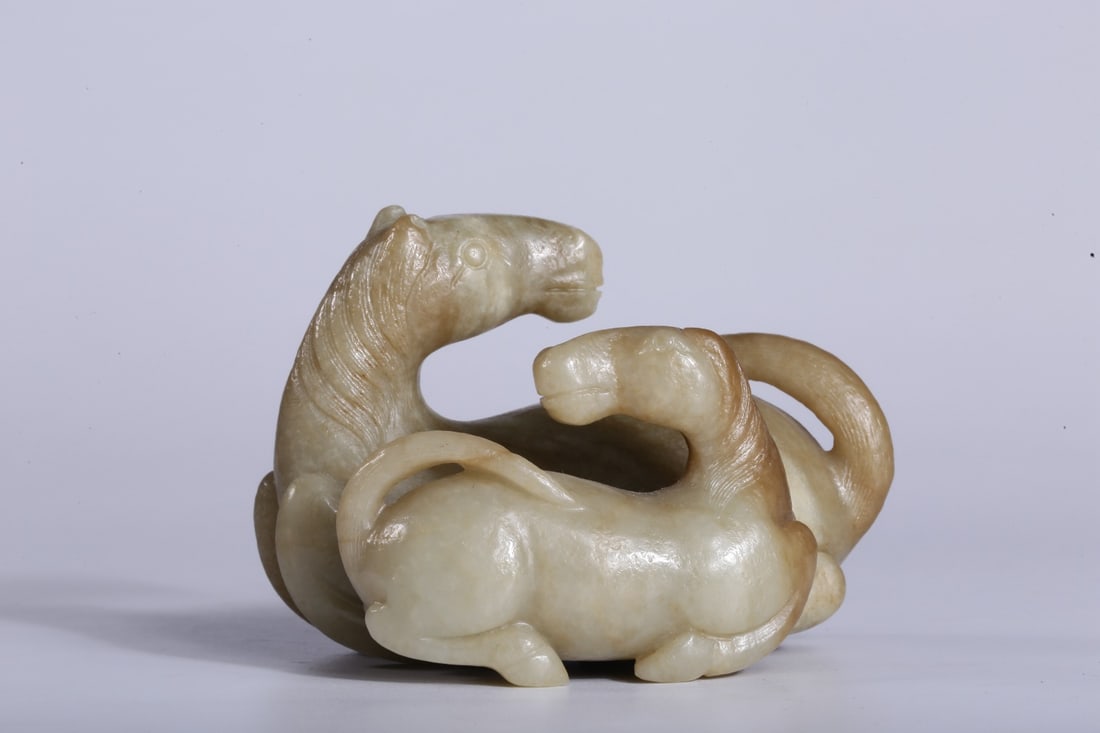 A Hetian White Jade Double-Horse Ornament: A Hetian White Jade Double-Horse Ornament. Dimensions: 2.56in x 3.46in x 2.36in; Weight: 315g.