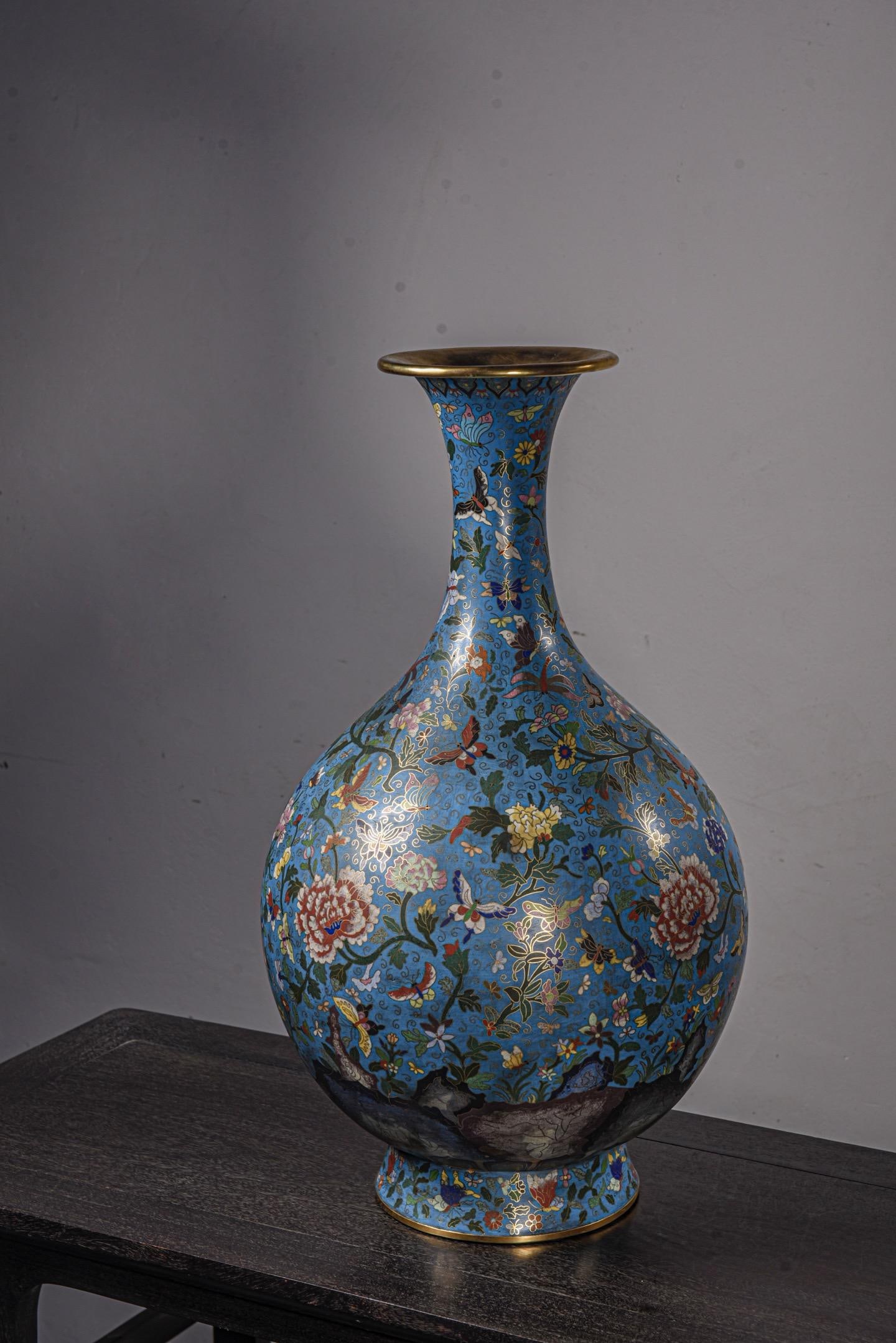 A Cloisonne Enamel Butterfly and Floral Vase: A Cloisonne Enamel Butterfly and Floral Vase. Height: 23.23in Diameter: 13.78in.